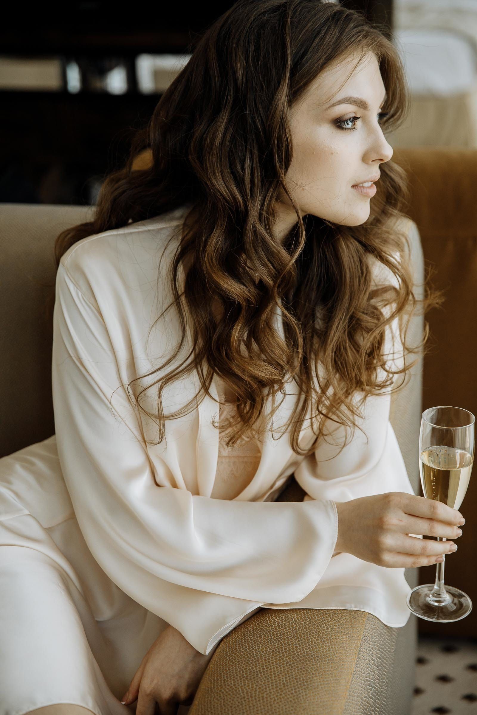 Editorial-style bridal preparation portrait of the bride in a robe, captured by Cornwall wedding photographer Tanya Bogdan.