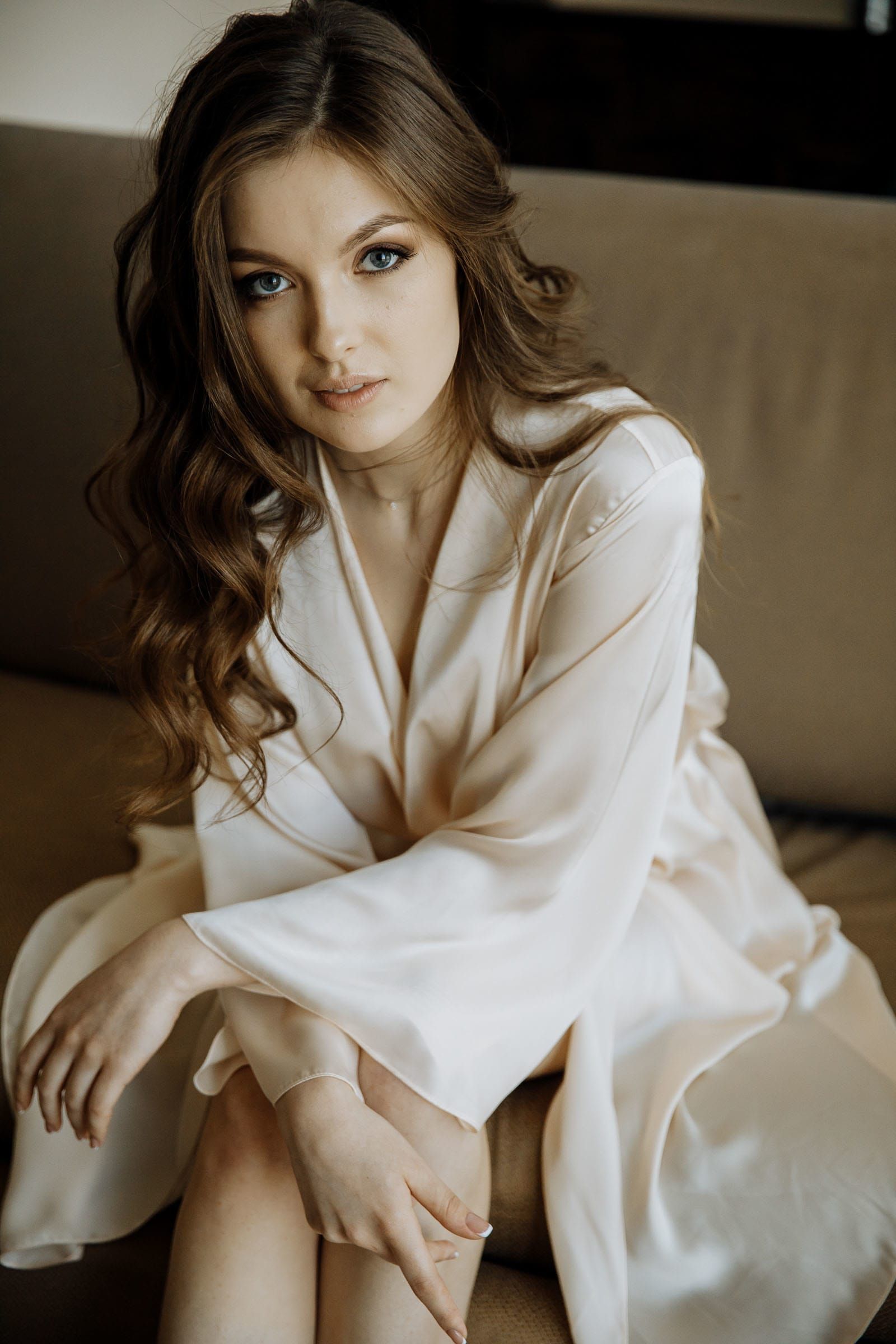 A gracefully posed bridal portrait during morning preparations, by Tanya Bogdan.