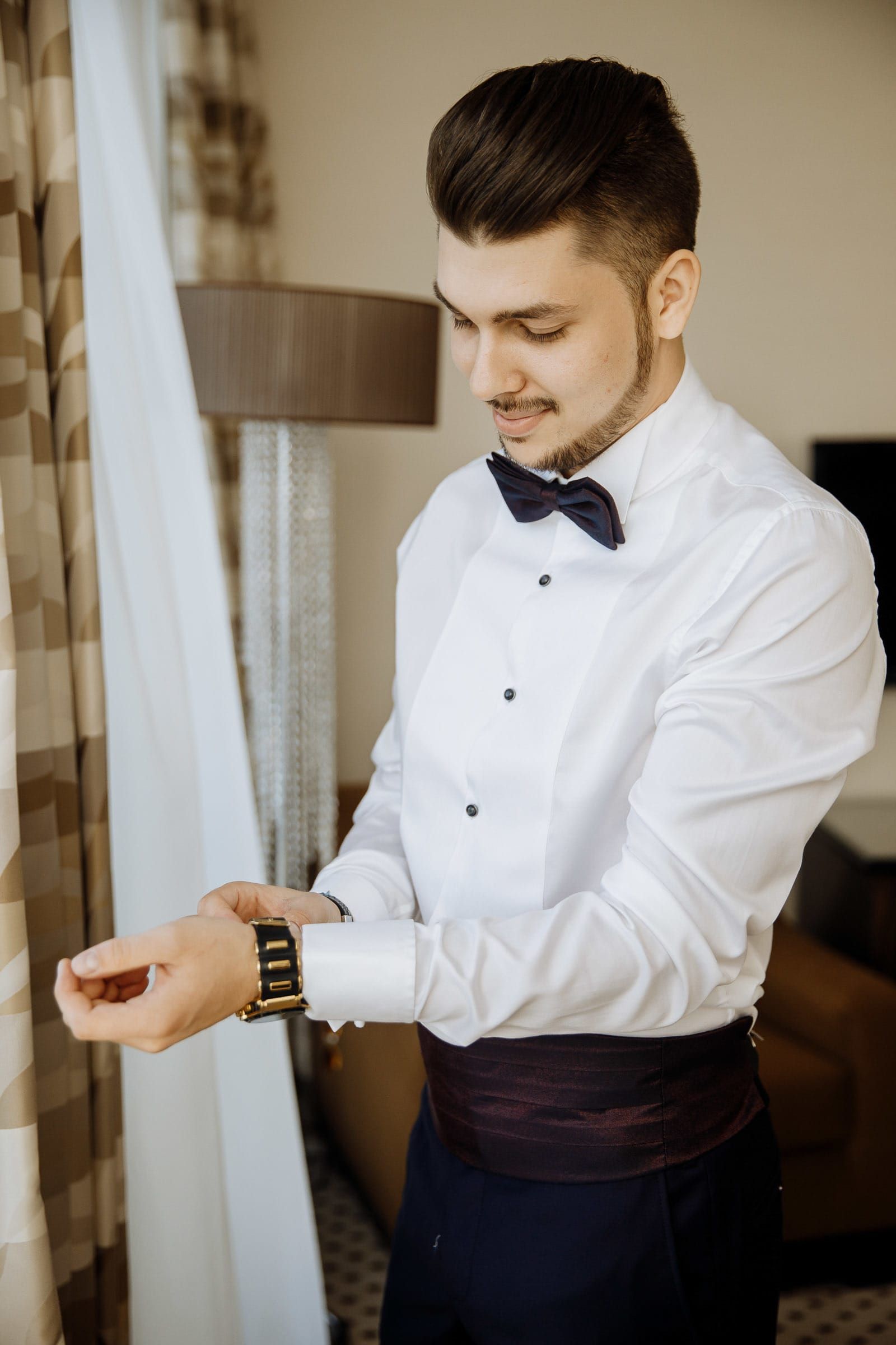 A luxury flatlay of the groom's watch and cufflinks, by a Cornwall wedding photographer, Tanya Bogdan.