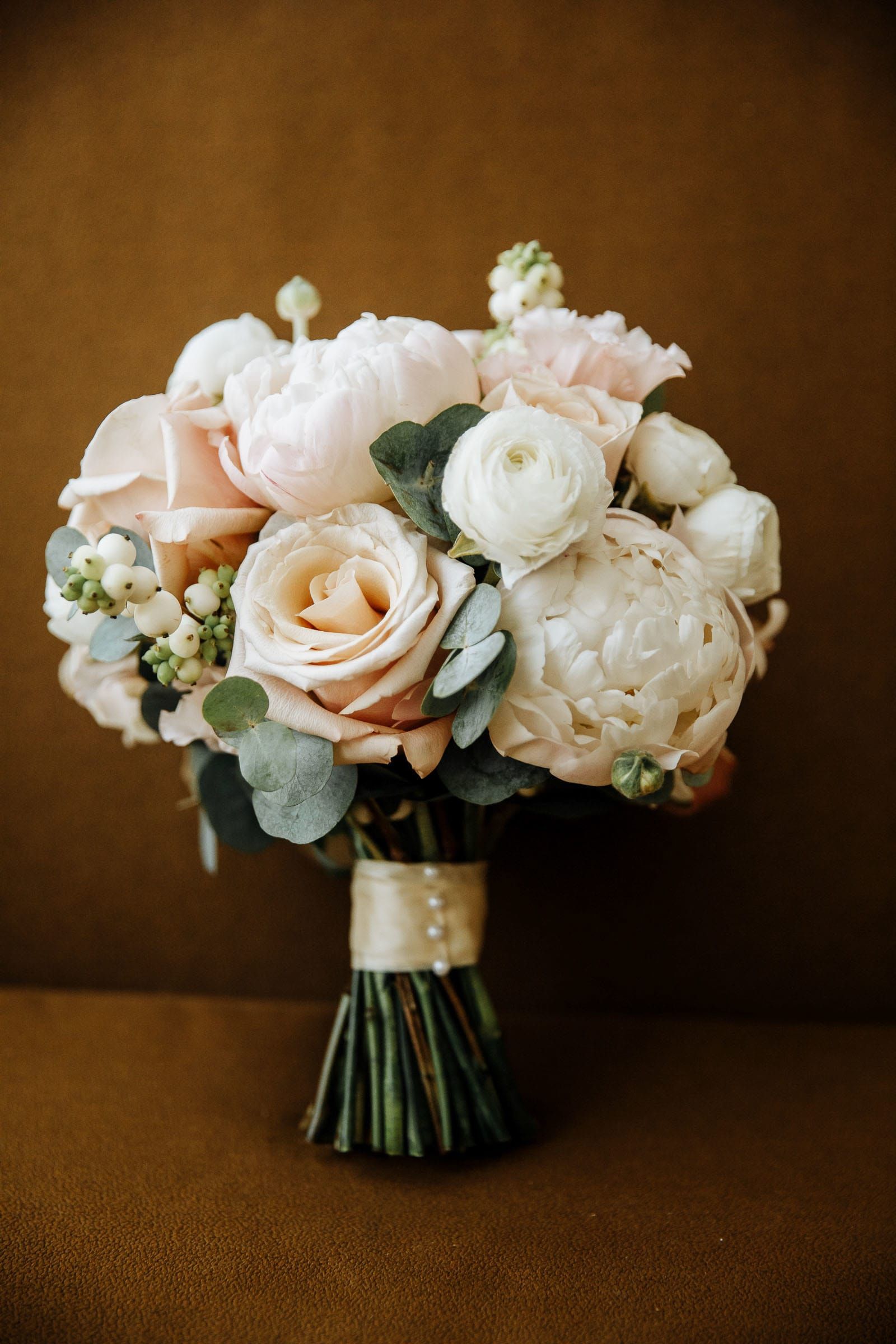 A high-end fine art photograph of a lush bridal bouquet, by a London wedding photographer, Tanya Bogdan.