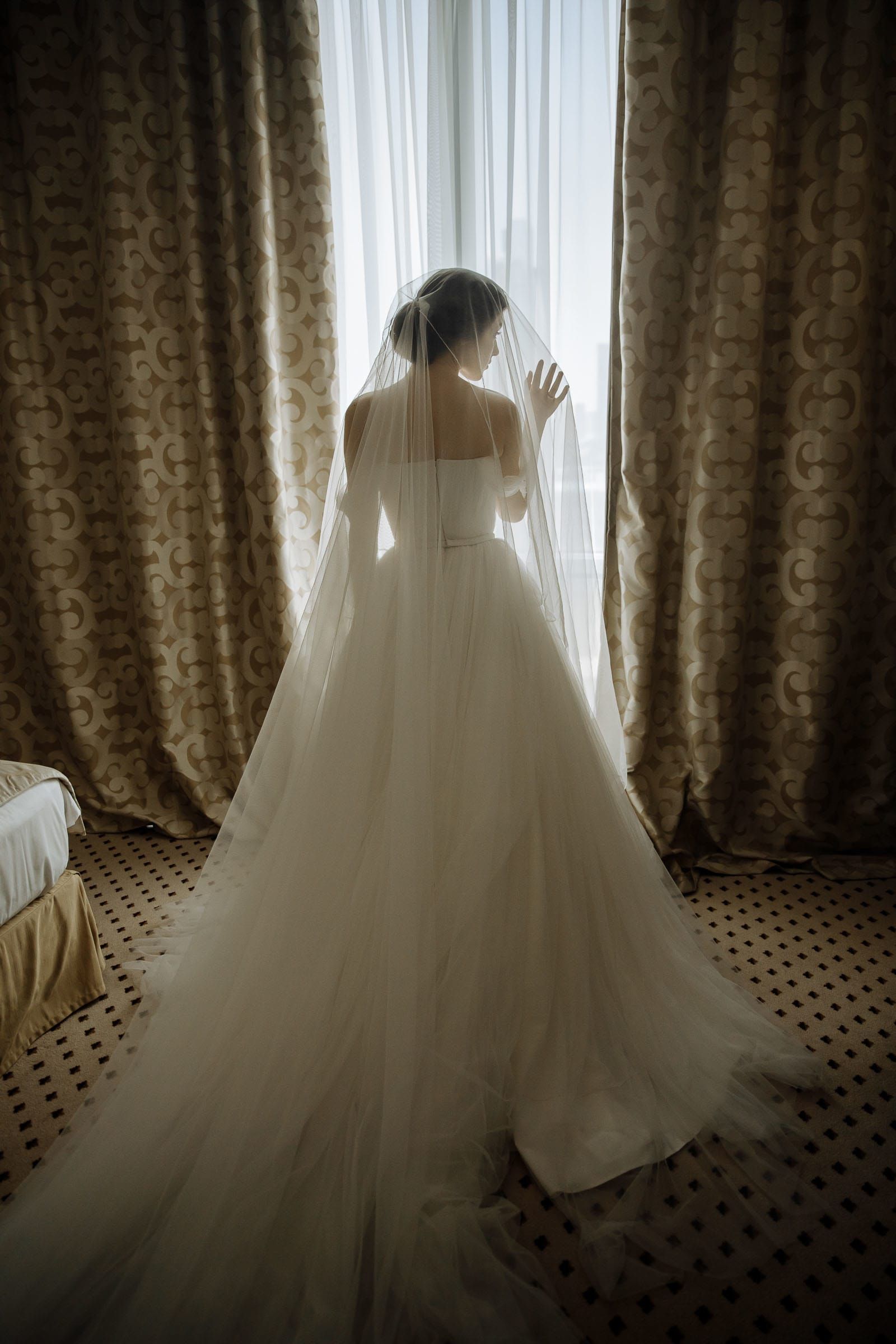 Editorial bridal portrait in soft window light, by a Cornwall wedding photographer, Tanya Bogdan.