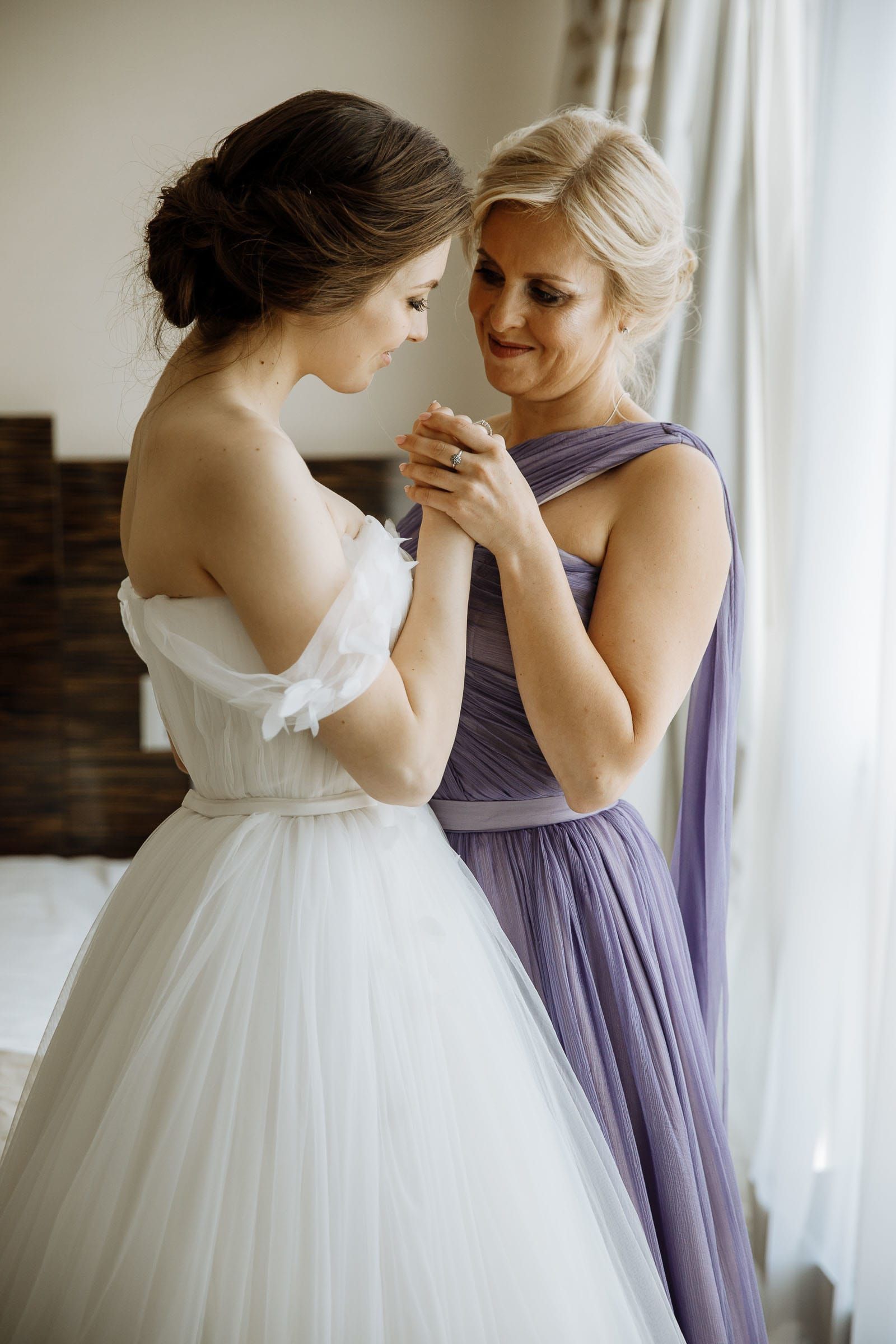 A sweet, unposed portrait of the bride and her mother together.