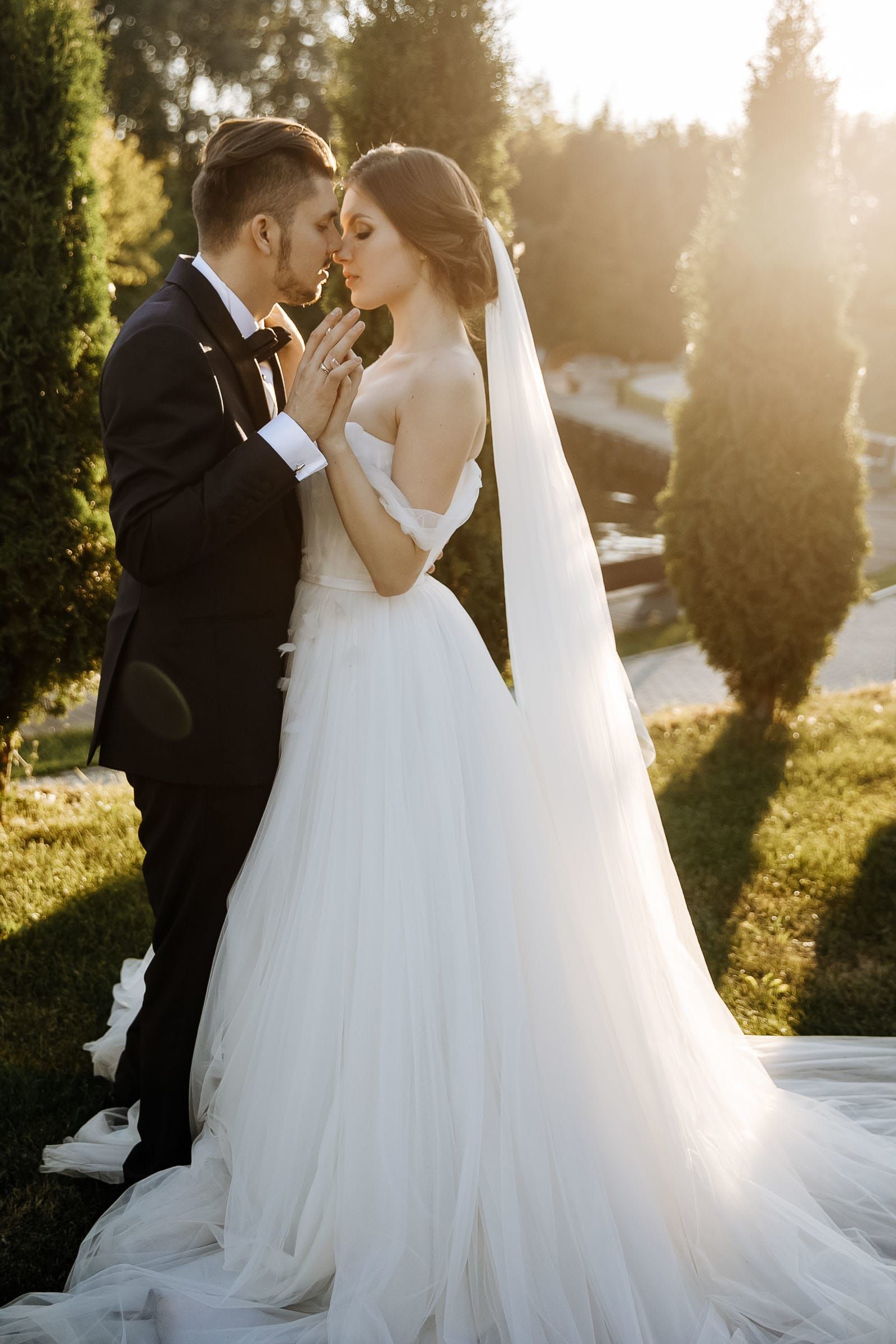 Intimate couple portrait in a garden, by a Cornwall wedding photographer, Tanya Bogdan.