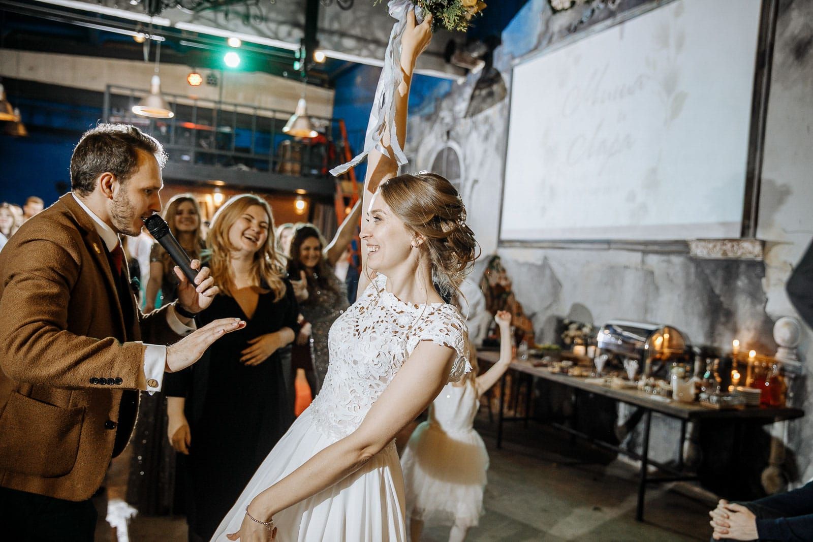London wedding photographer Tanya Bogdan capturing the traditional bouquet toss.