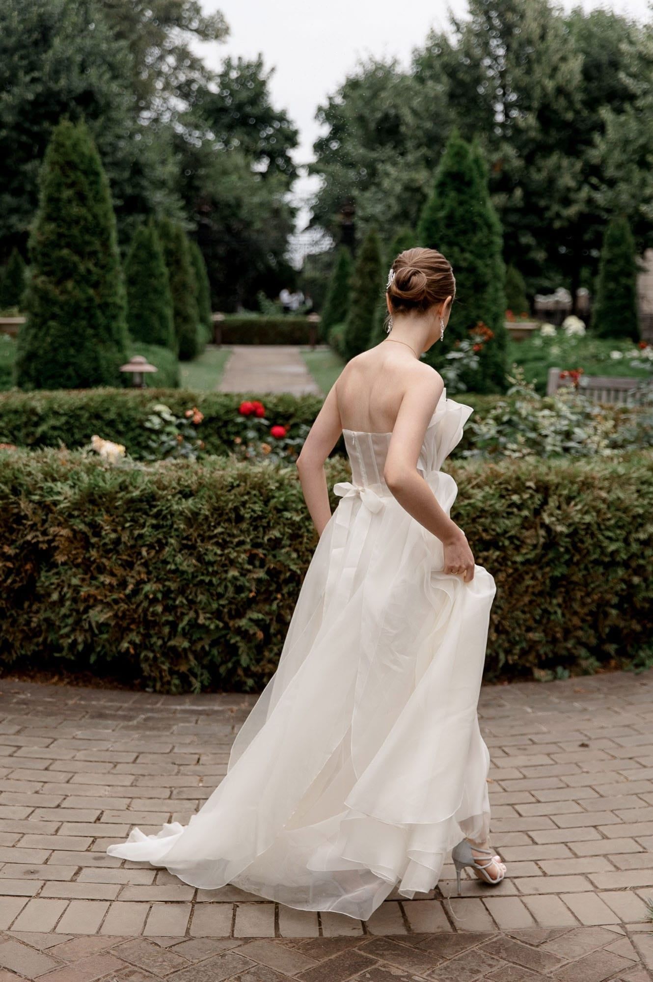 Elegant bride portrait captured in a garden during a destination wedding