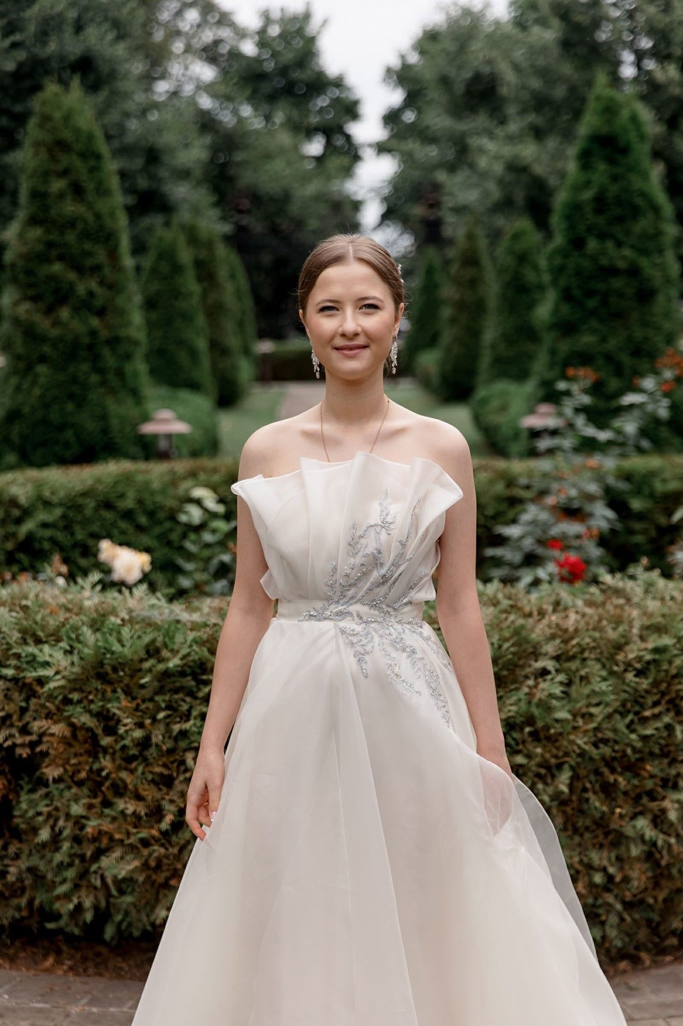 Editorial bridal portrait in a romantic garden setting at a destination wedding