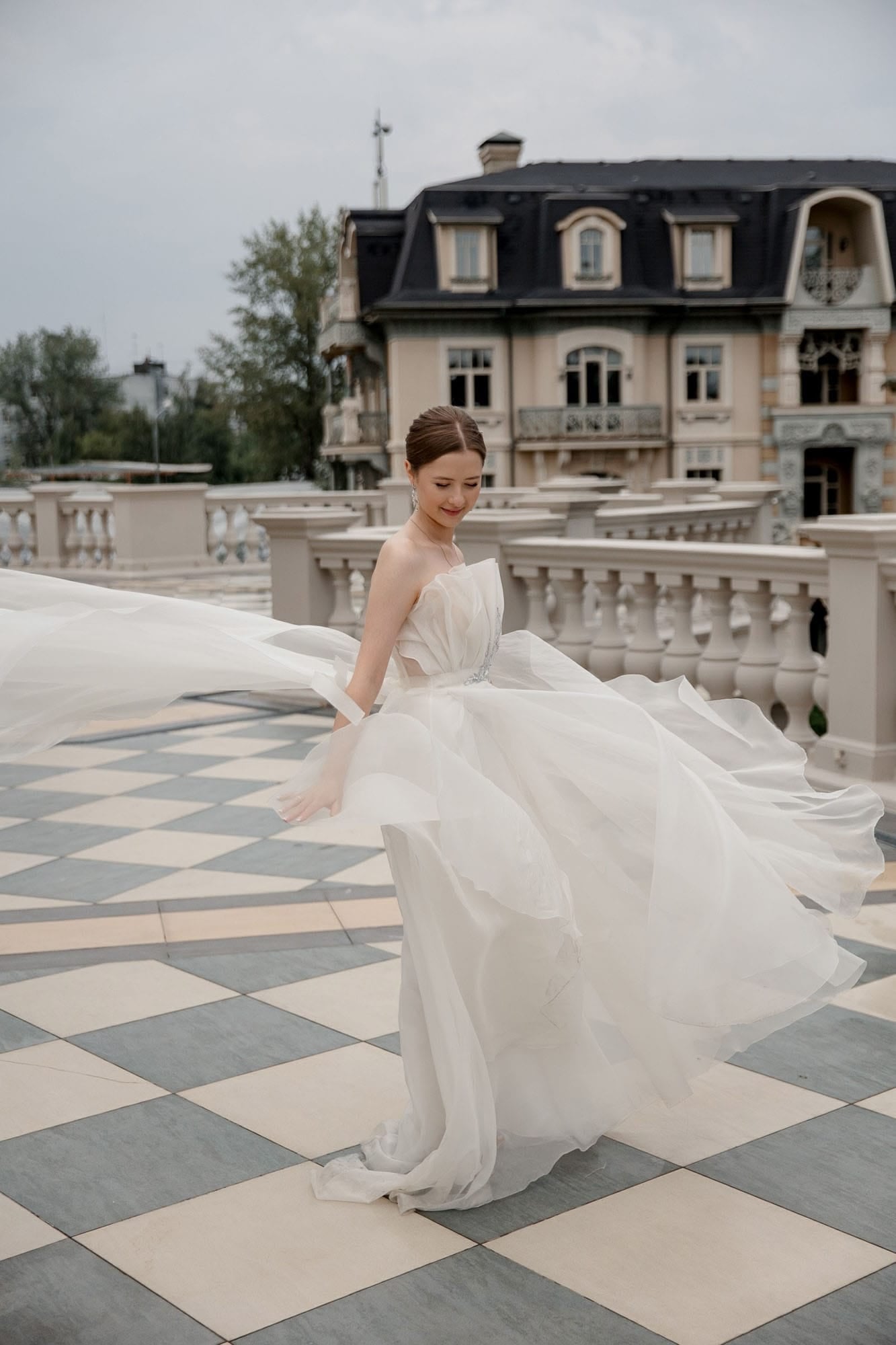Editorial portrait of the bride at a classical venue during a destination wedding