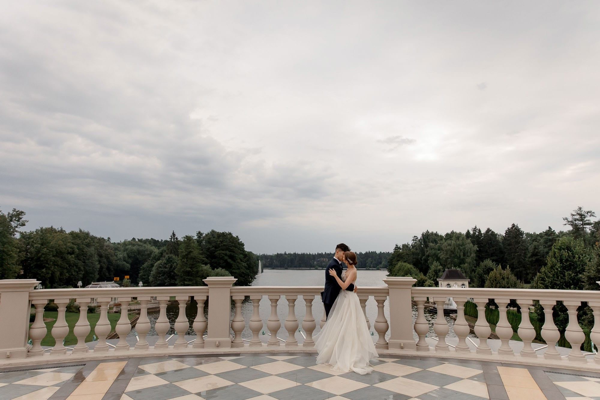 Bride and groom portrait on a balcony during a luxury destination wedding