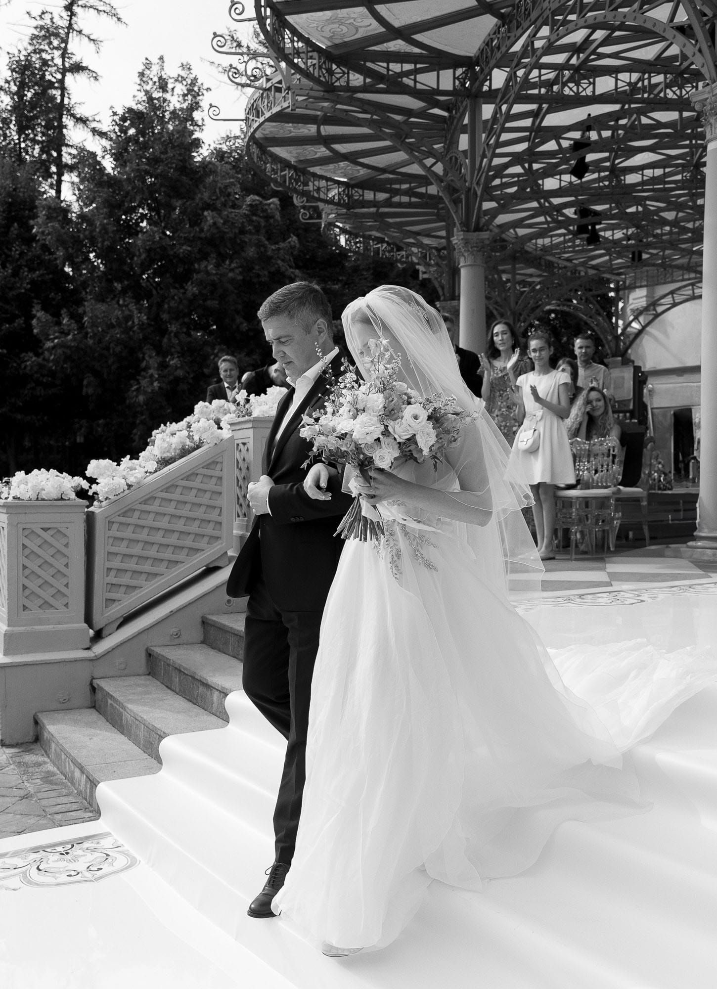 Emotional moment of father walking the bride down the aisle during the wedding ceremony