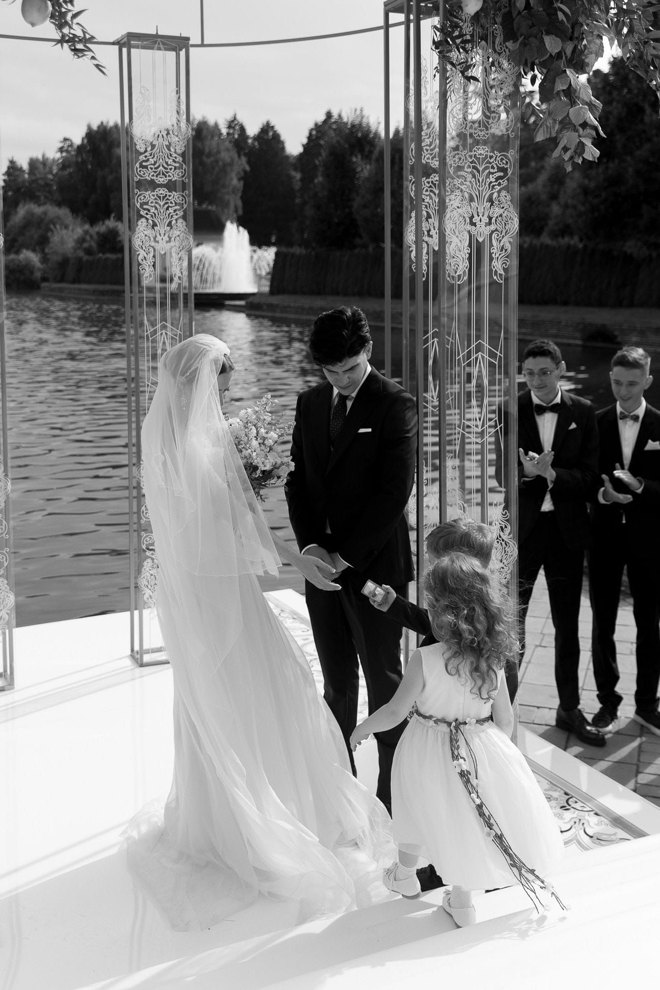 Flower girl and page boy handing the rings over at a destination wedding ceremony