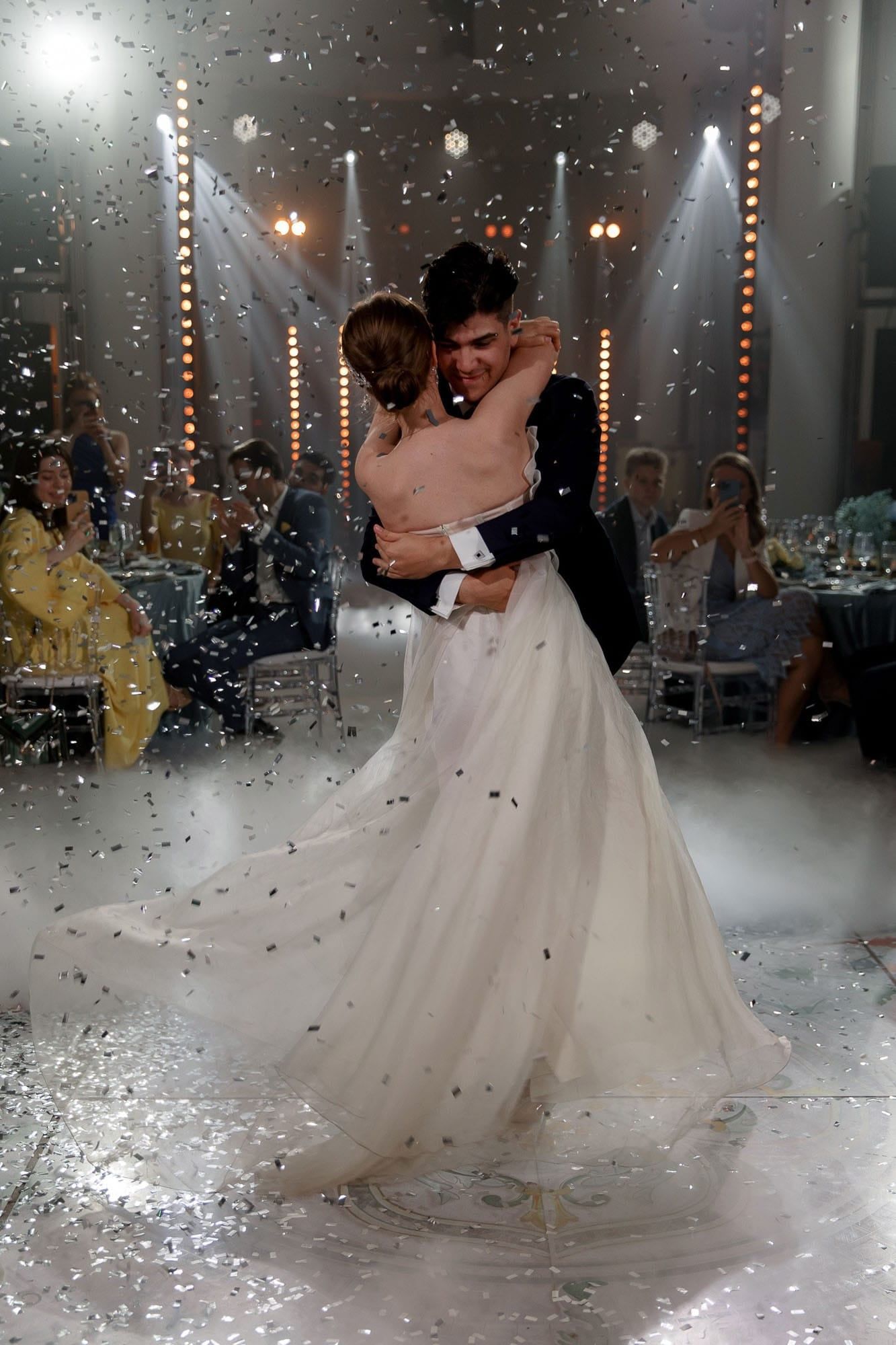 Emotional first dance moment between bride and groom during their destination wedding reception