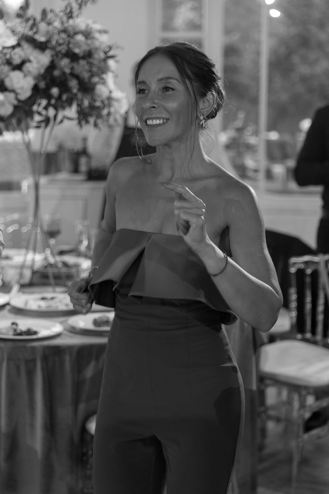 Close-up of a smiling guest enjoying the atmosphere at a destination wedding reception