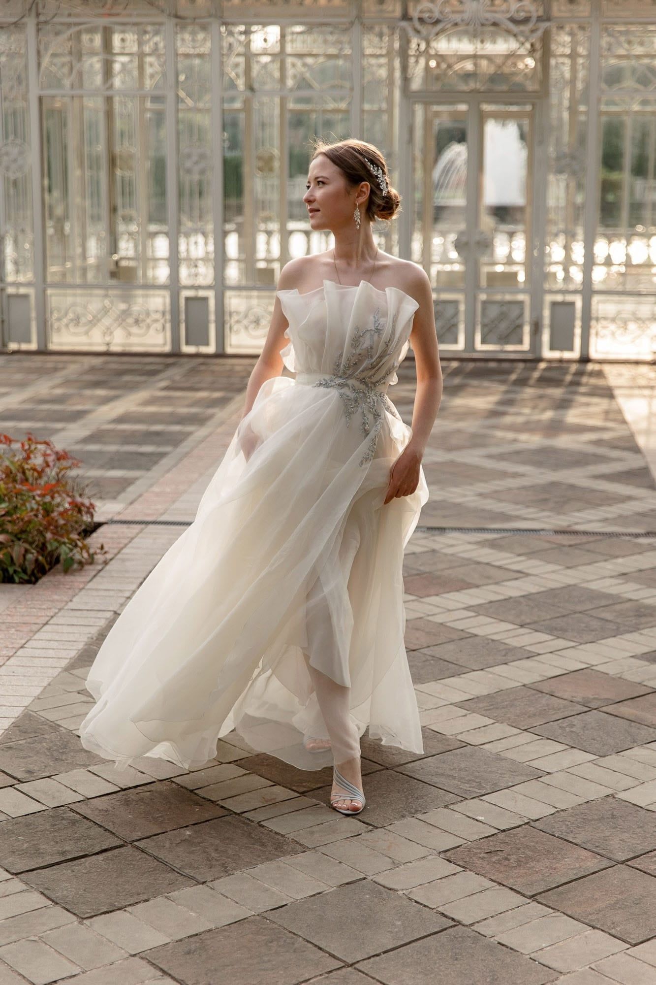 Editorial bridal portrait in a classical architectural setting at a luxury destination wedding