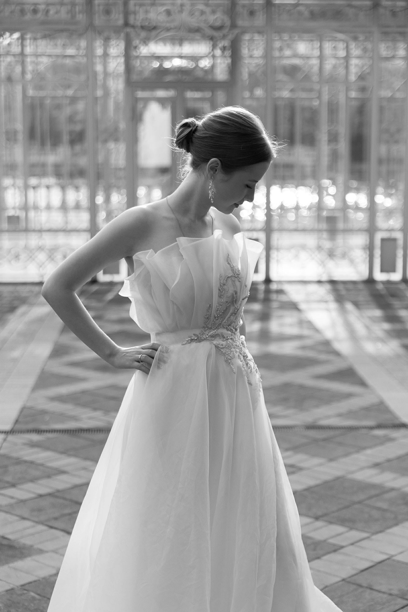 Bride portrait highlighting luxury bridal fashion against classical architecture
