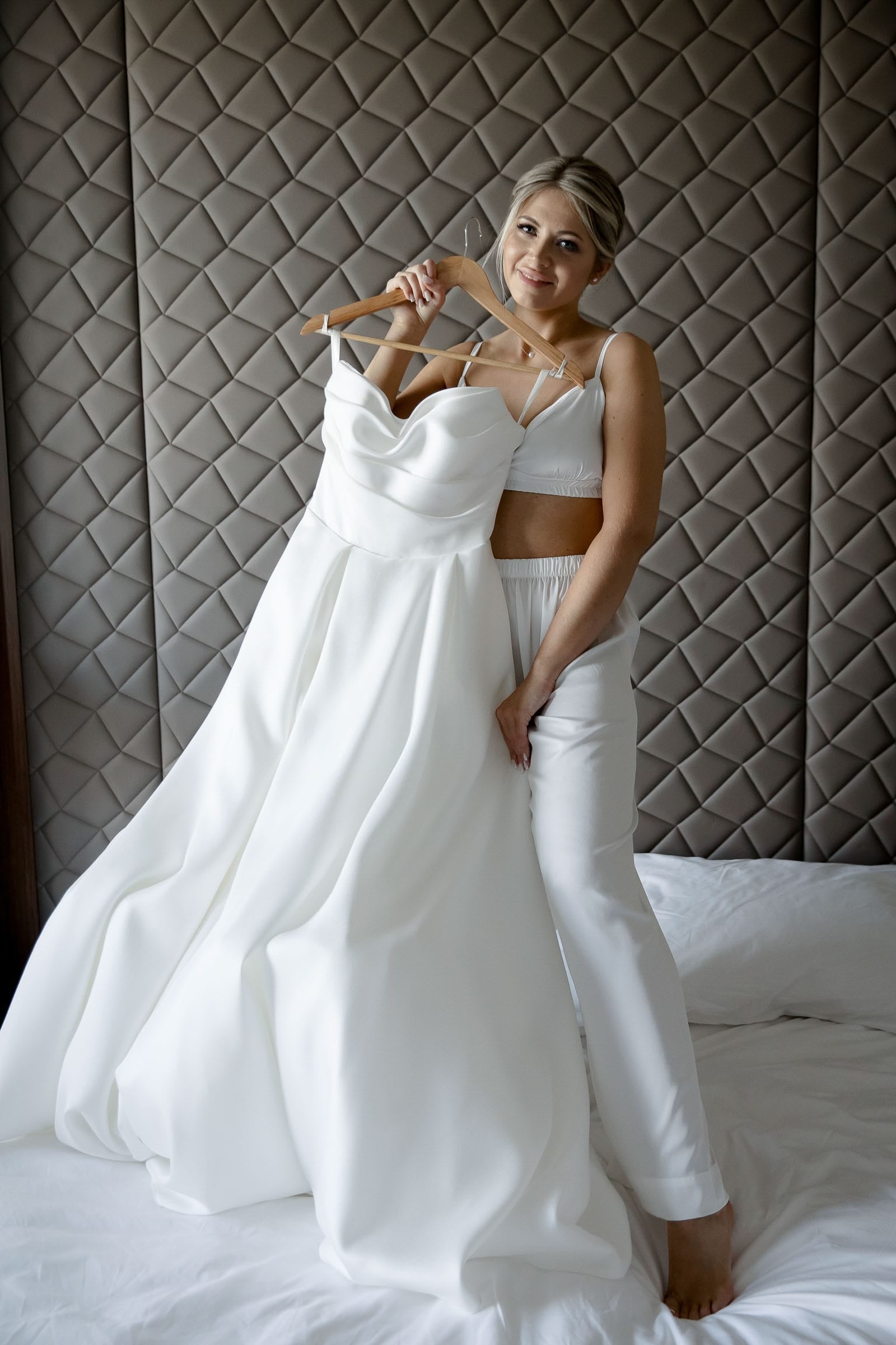 Candid moment of a bride holding her wedding dress from Bude wedding photographer Tanya Bogdan.