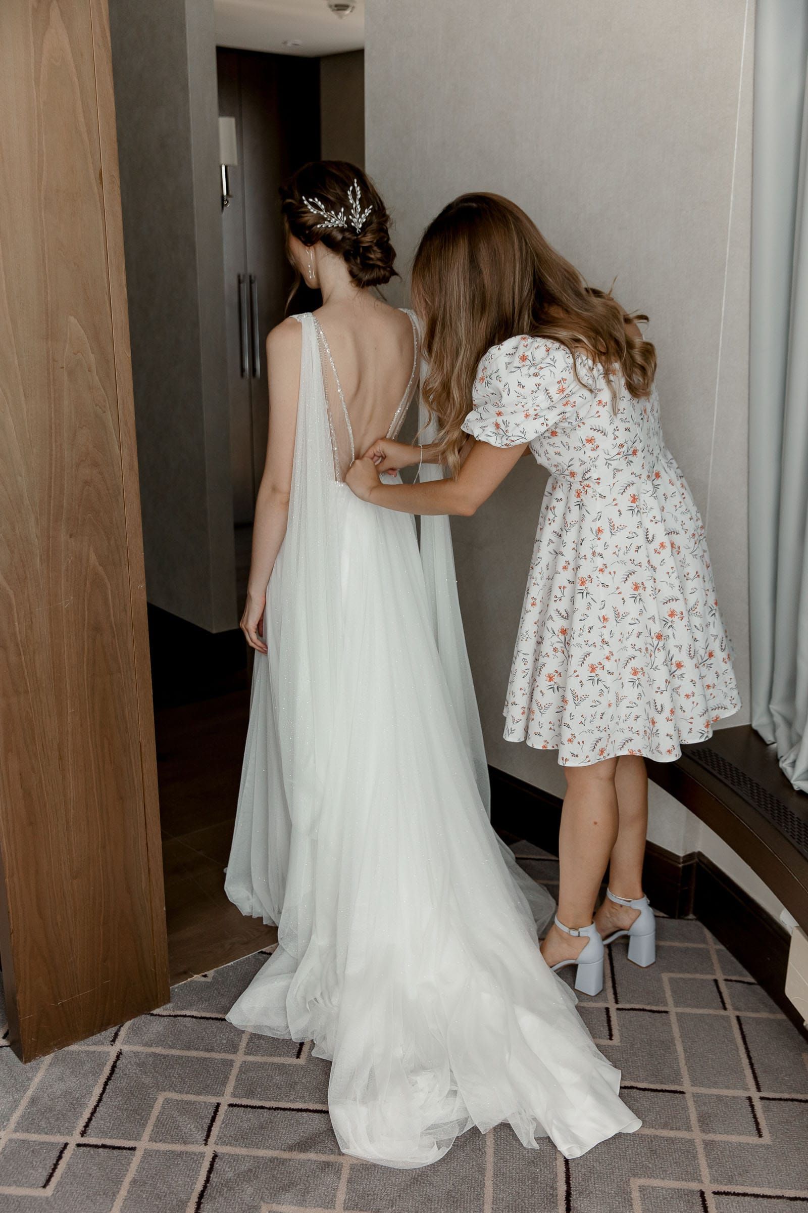 Candid wedding morning preparations by a professional wedding photographer based in Bude.