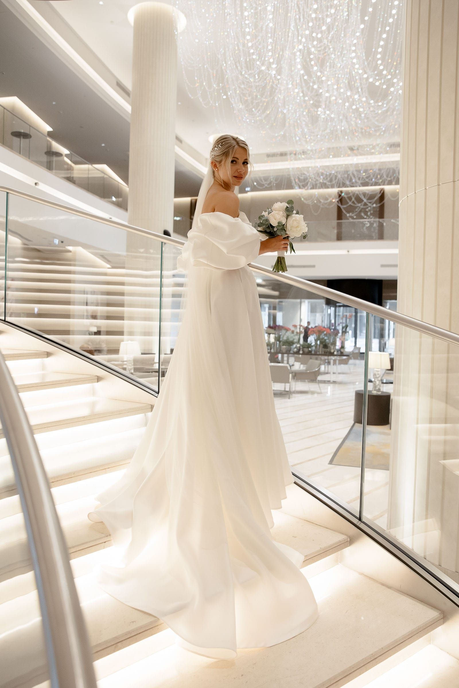 Sophisticated bridal portrait on a staircase from Cornwall wedding photographer Tanya Bogdan.