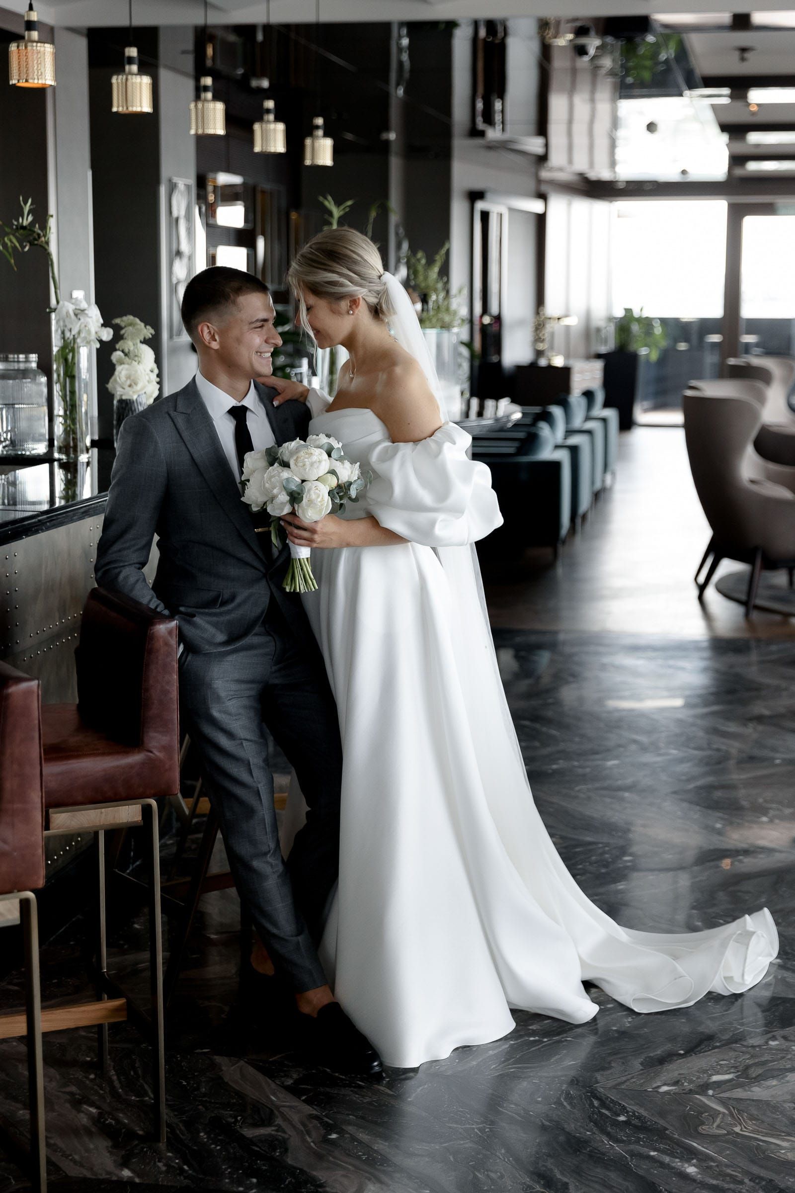 Documentary bride and groom portrait at a bar from Cornwall wedding photographer Tanya Bogdan.