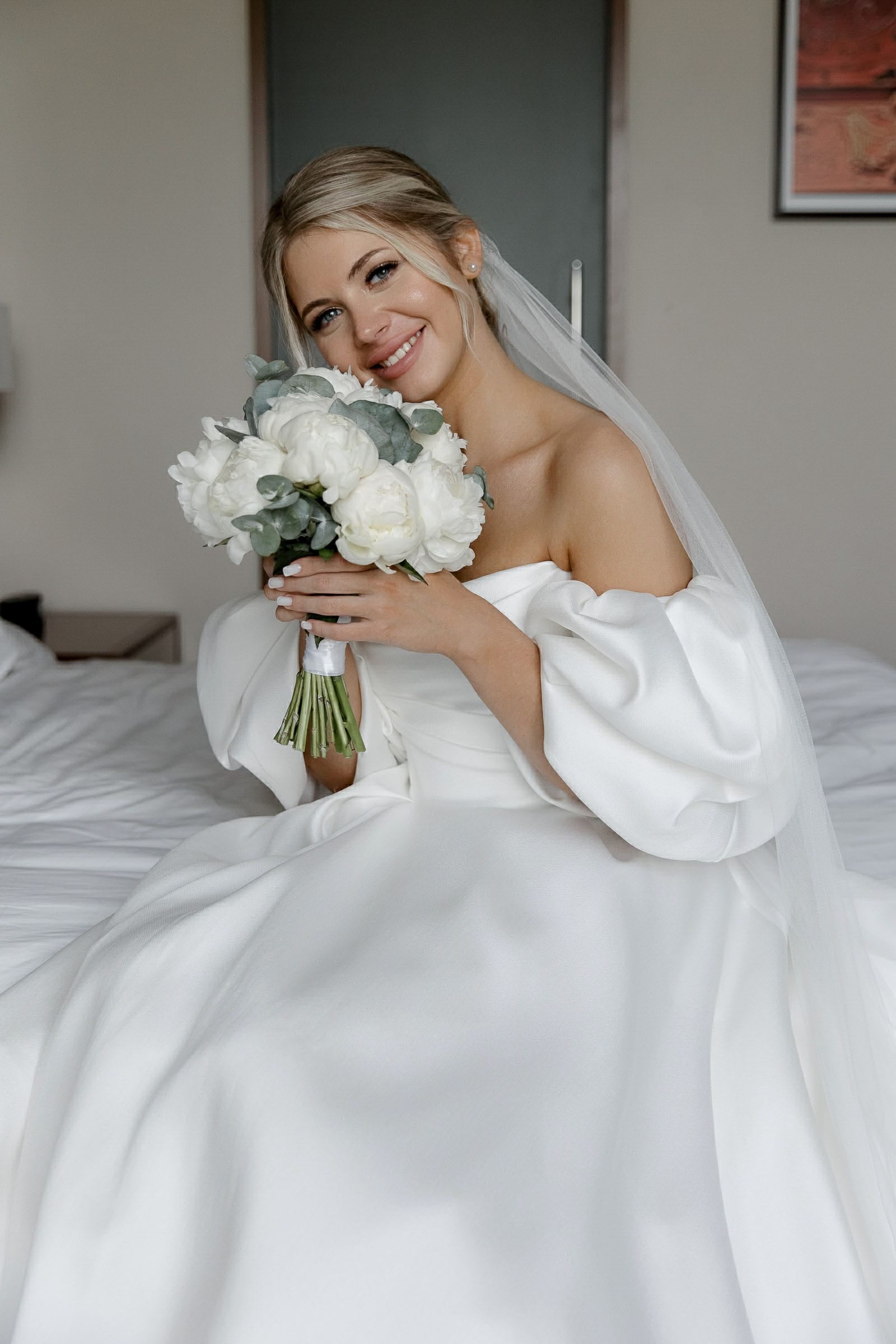 Fine art bridal portrait holding bouquet, by Cornwall wedding photographer Tanya Bogdan.