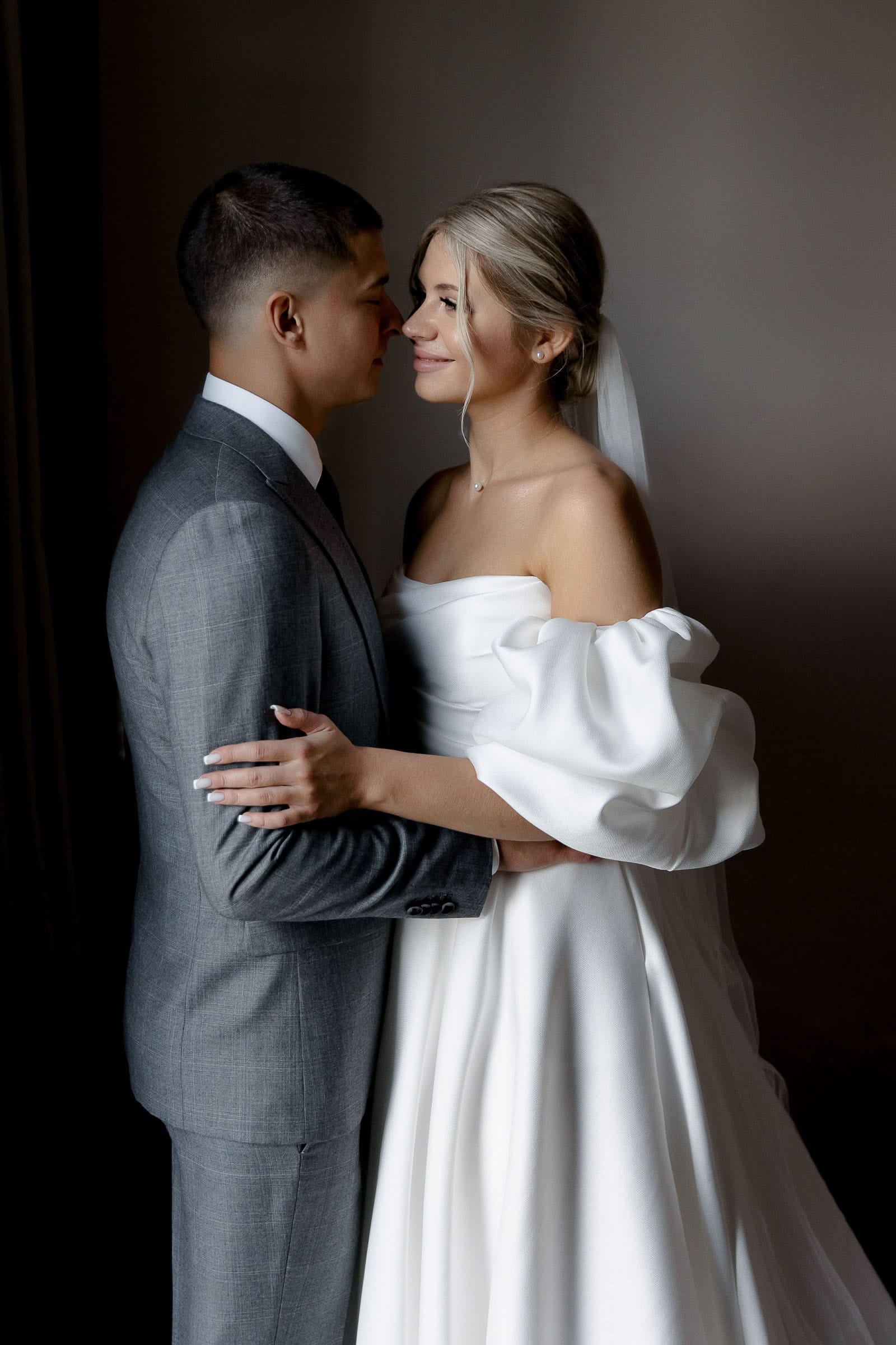 Documentary-style indoor wedding couple portrait from Bude wedding photographer Tanya Bogdan.