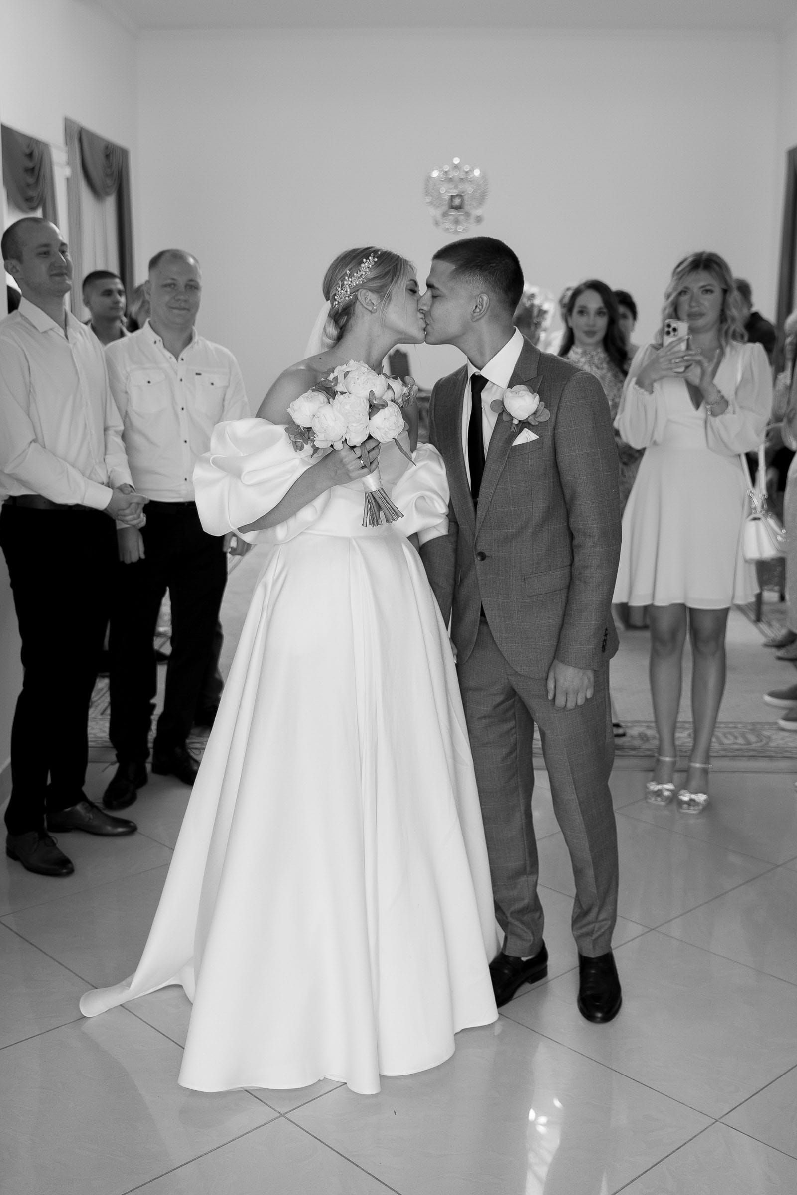 Candid kiss after the wedding ceremony from Bude wedding photographer Tanya Bogdan.