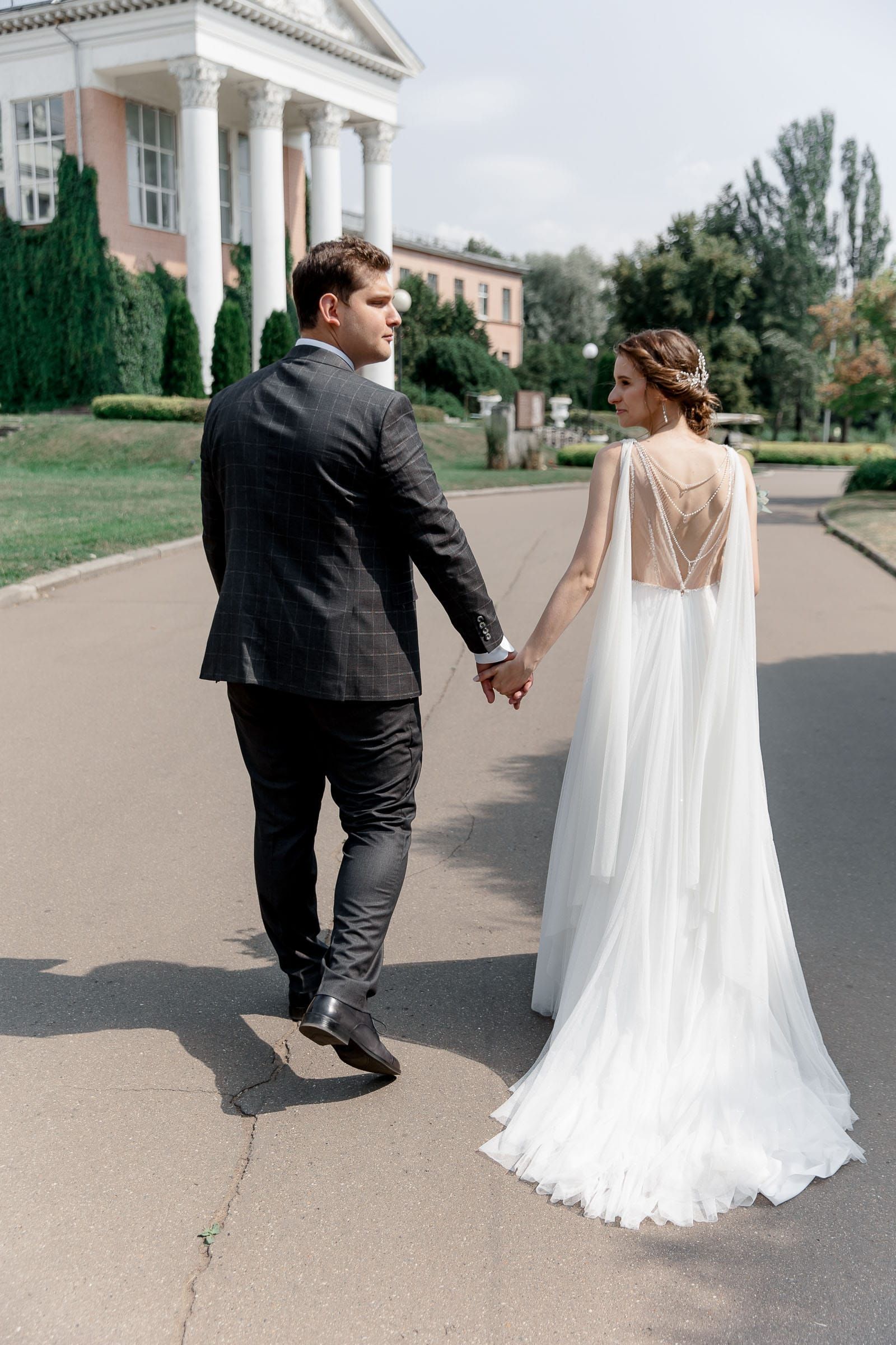 A candid shot of the bride and groom walking together, captured by Tanya Bogdan.
