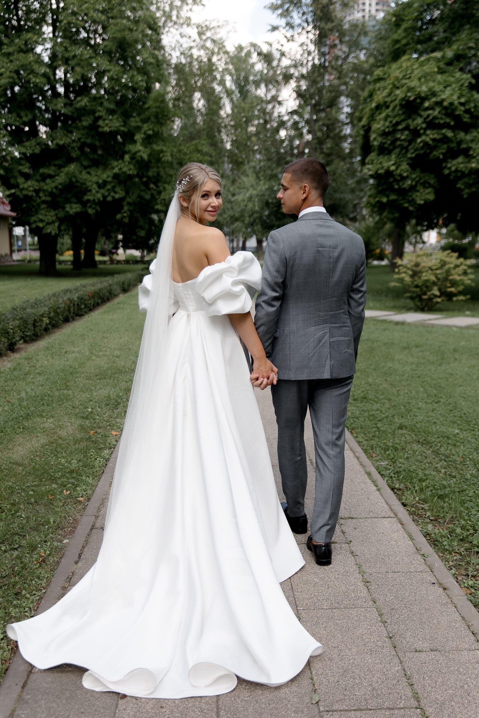 Professional documentary photography of a couple walking from Bude wedding photographer Tanya Bogdan.