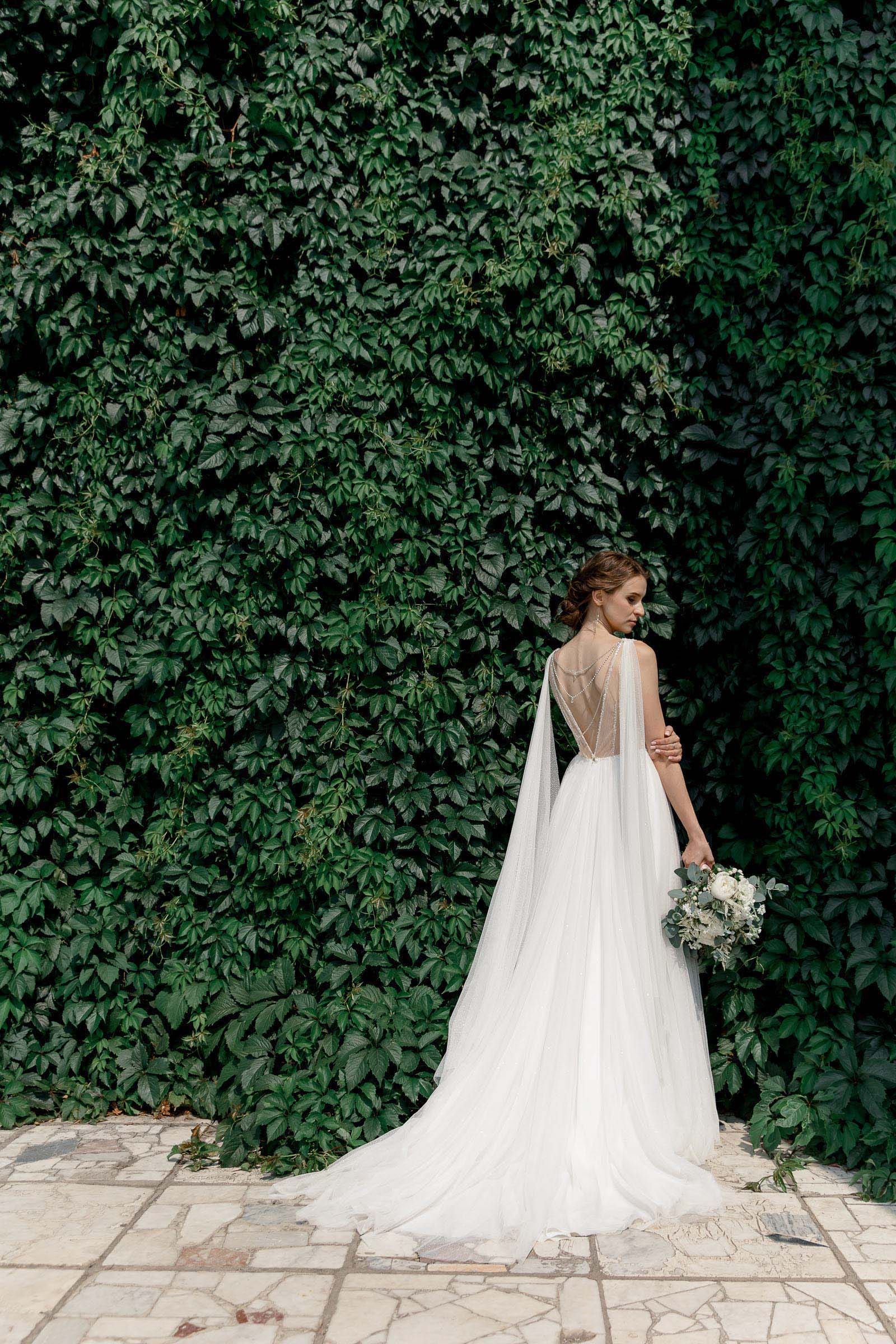 An editorial bridal portrait set in a garden maze, photographed by Tanya Bogdan, a Bude wedding photographer.