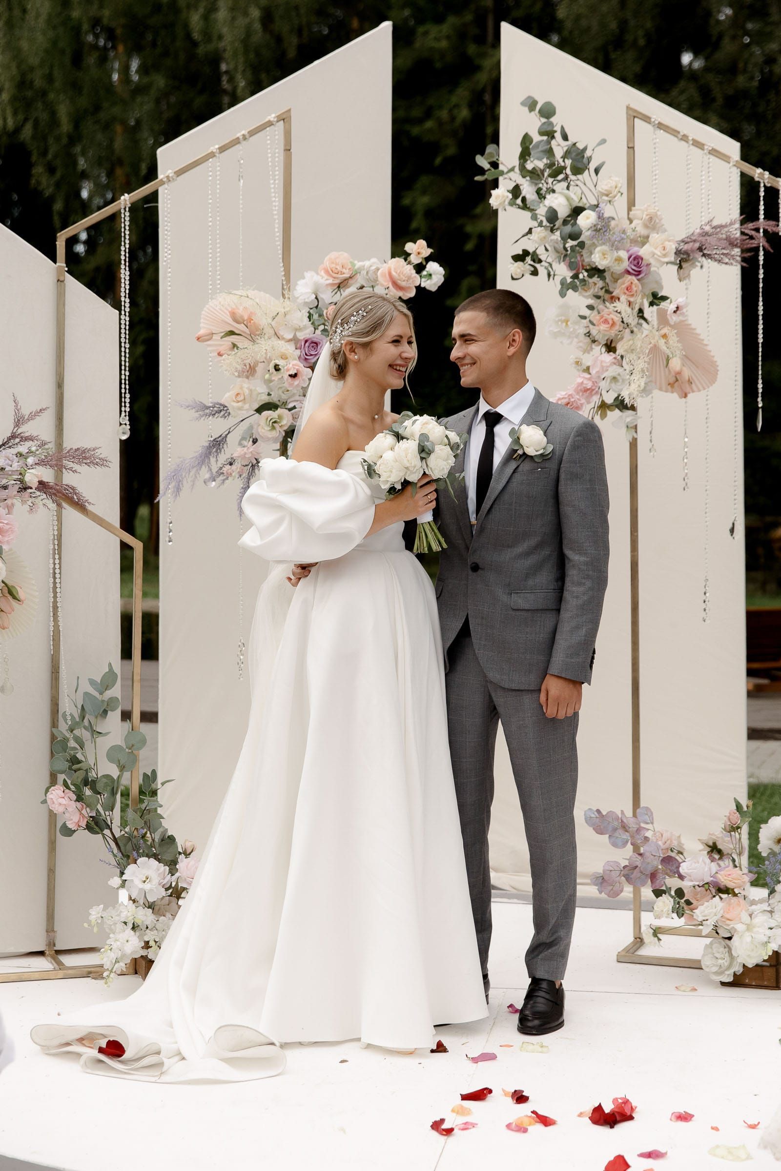 Fine art ceremony portrait of newlyweds at an outdoor venue from Plymouth wedding photographer Tanya Bogdan.