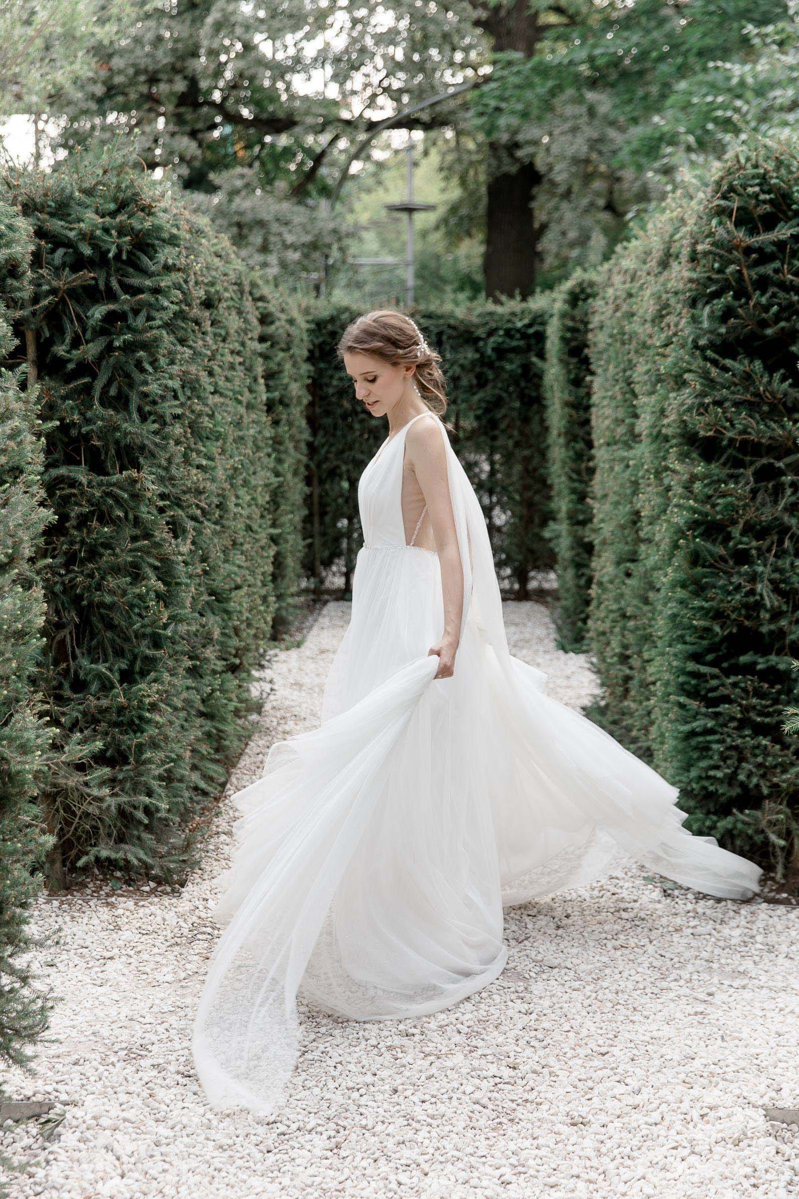 Timeless editorial bride portrait in a garden maze by Bude wedding photographer Tanya Bogdan.