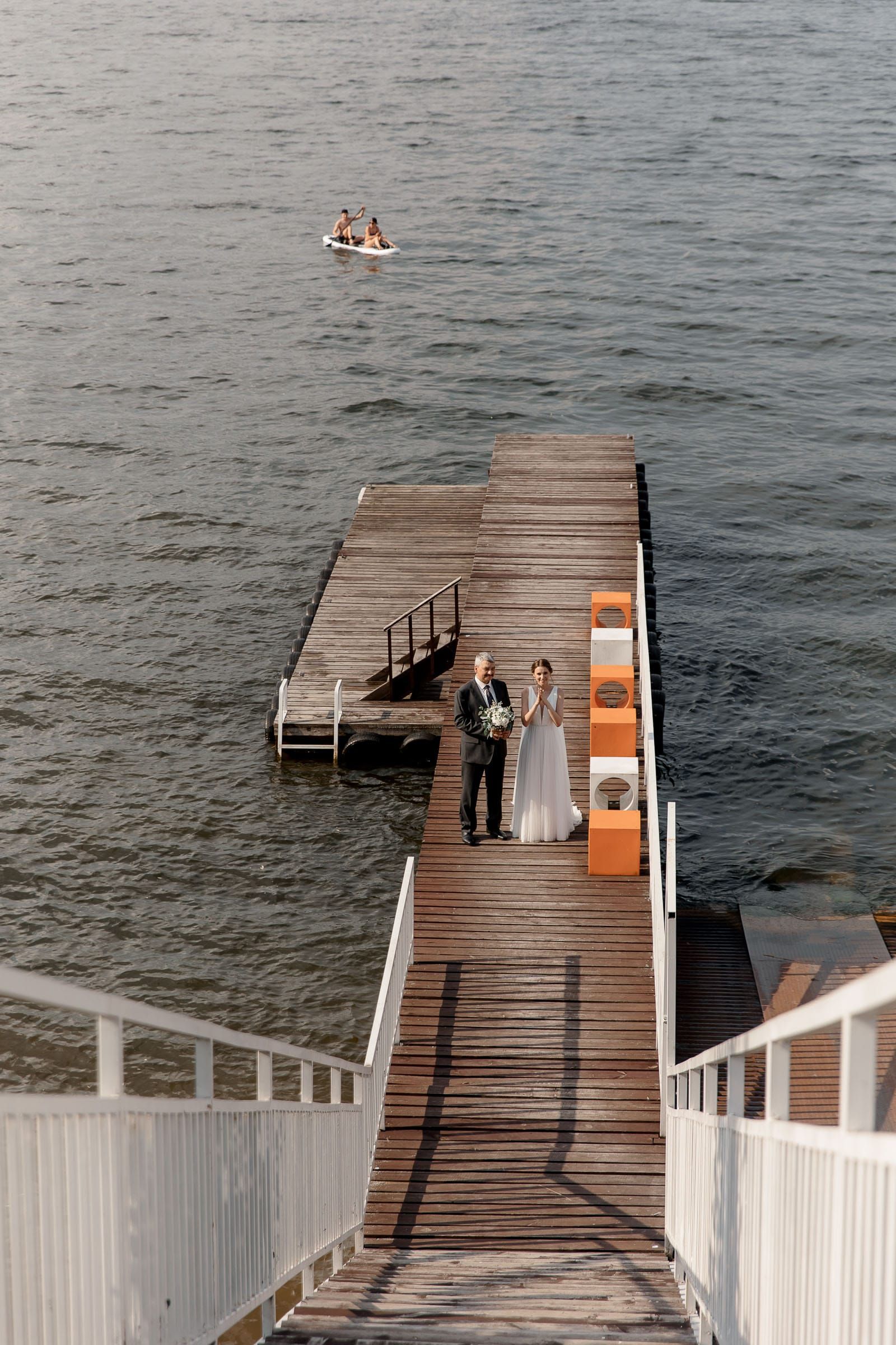 A wide-angle view of a wedding ceremony in a unique location by Tanya Bogdan.
