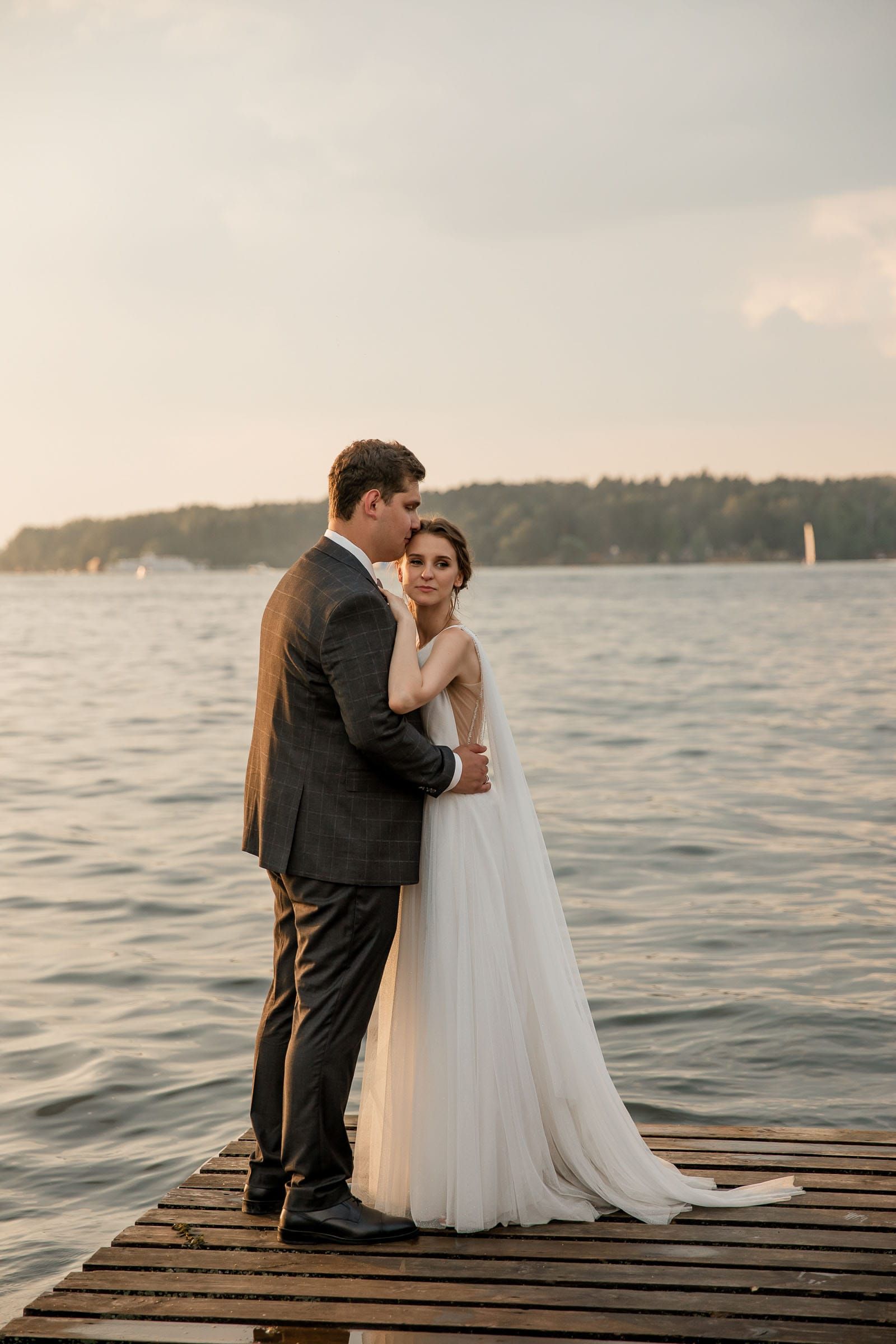Modern editorial bride and groom portraits by the river, photographed by a South West wedding photographer.