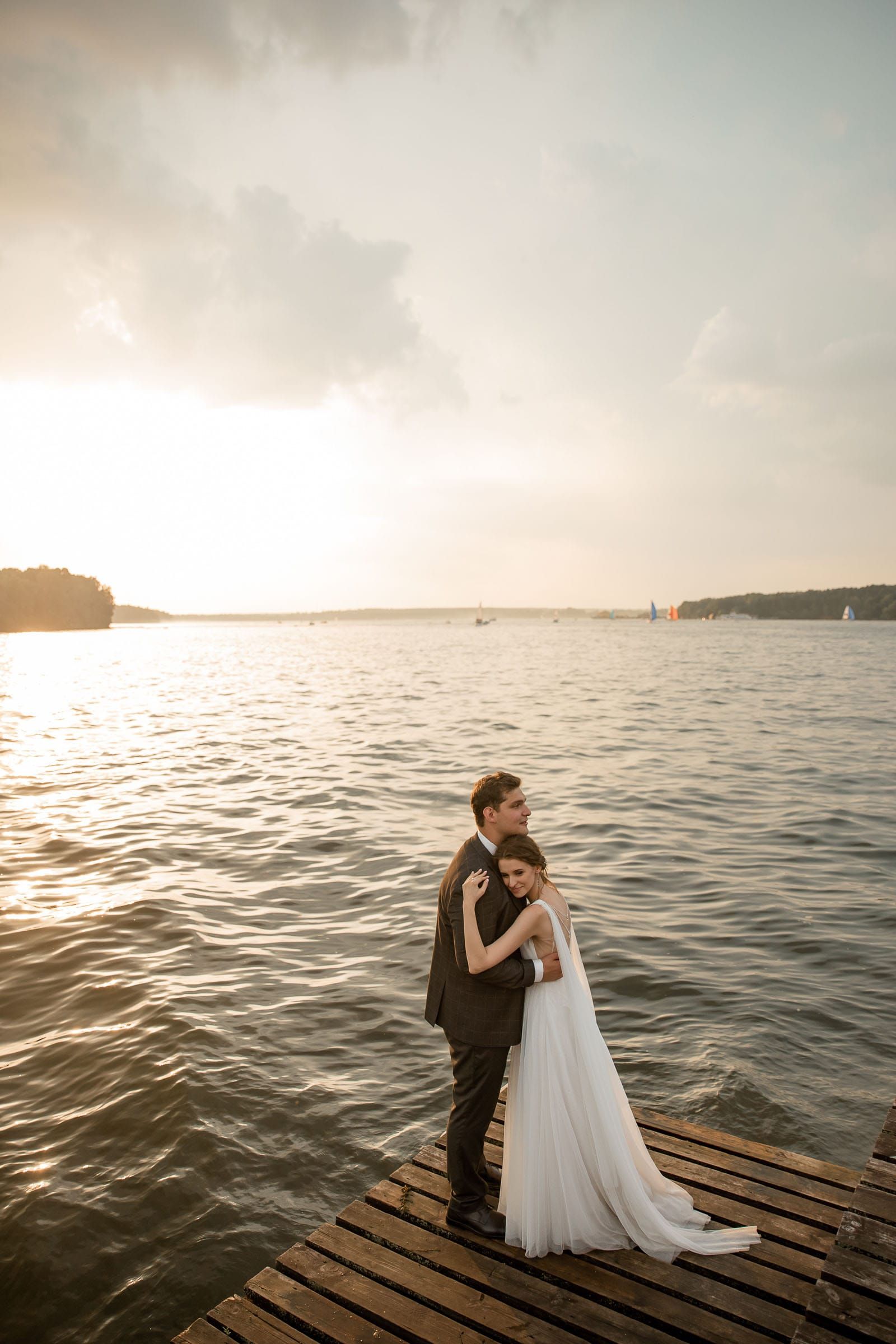 Modern editorial bride and groom portraits by the river, photographed by a South West wedding photographer.