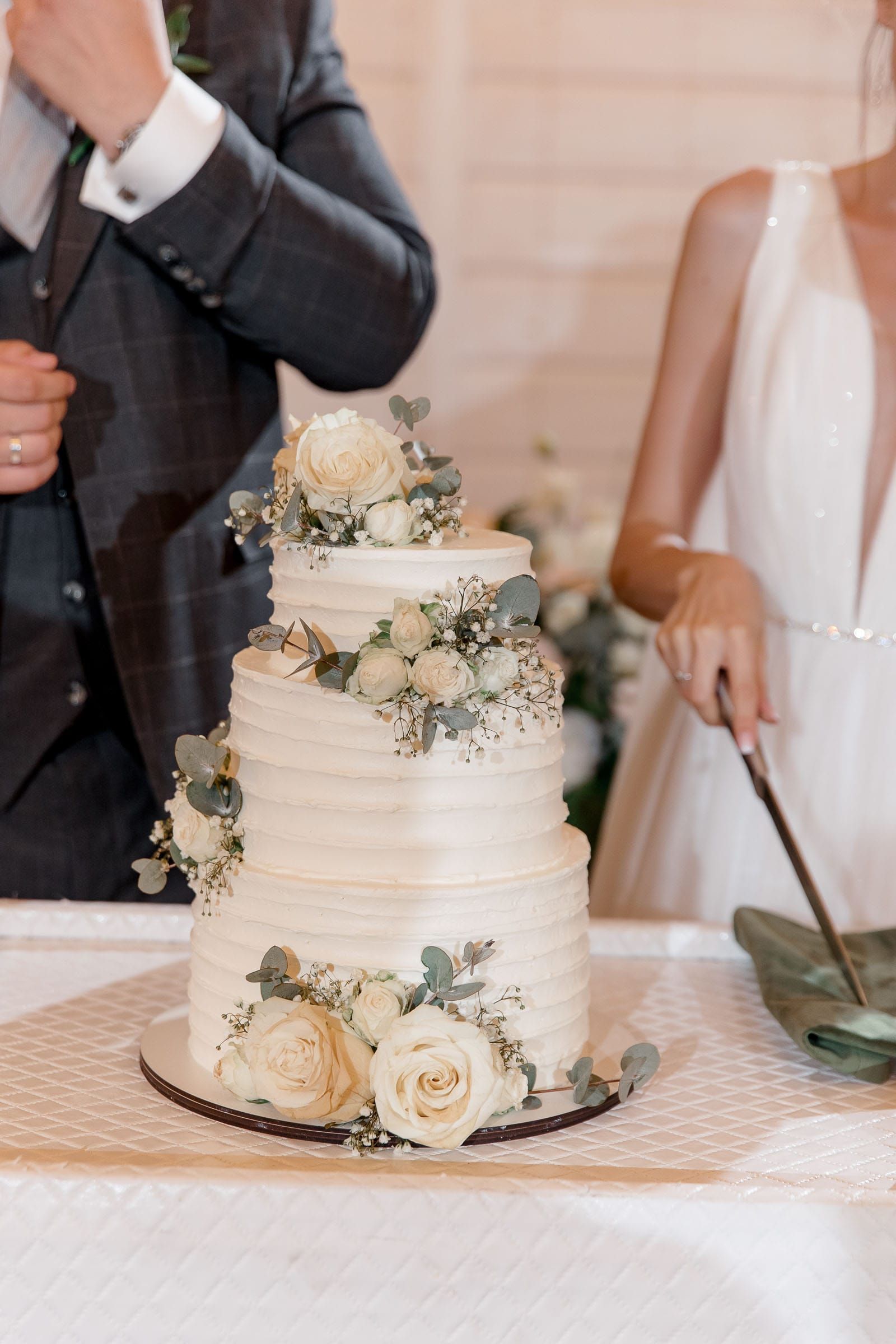 Wedding cake cut captured in a candid documentary style by Tanya Bogdan.