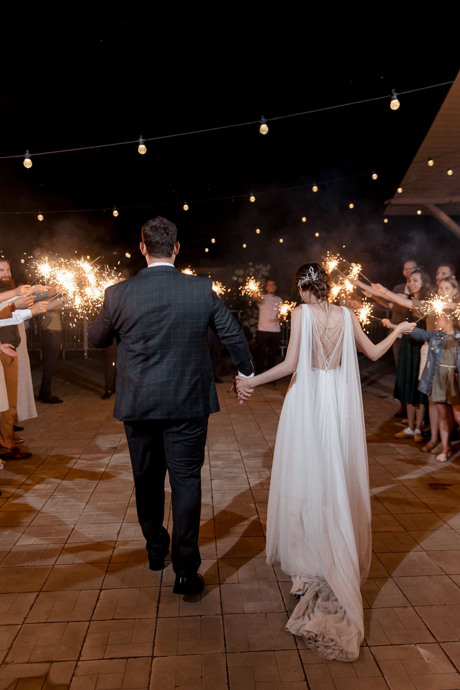 The bride and groom’s sparkler exit, captured by London wedding photographer Tanya Bogdan.