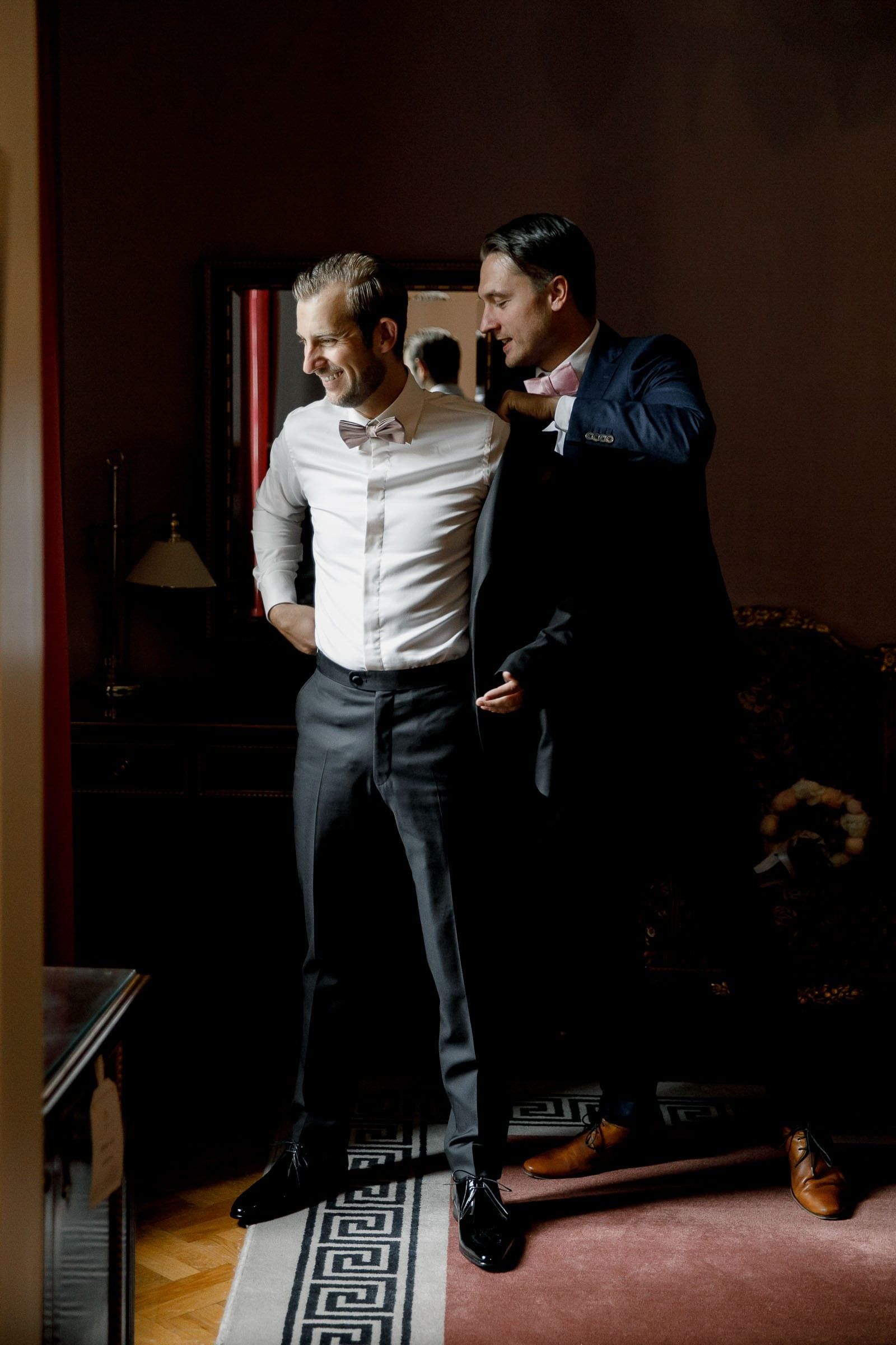 Modern documentary photography of a groom getting ready by London wedding photographer Tanya Bogdan.