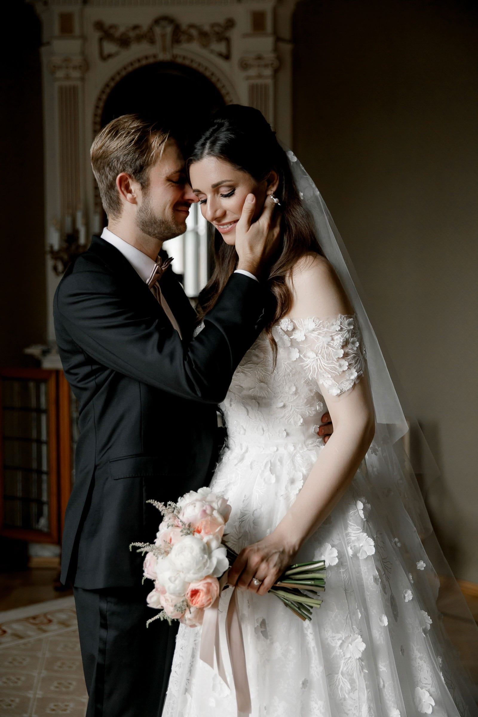 Documentary-style first look portrait in a grand interior by Tanya Bogdan, serving Devon and the Cotswolds.