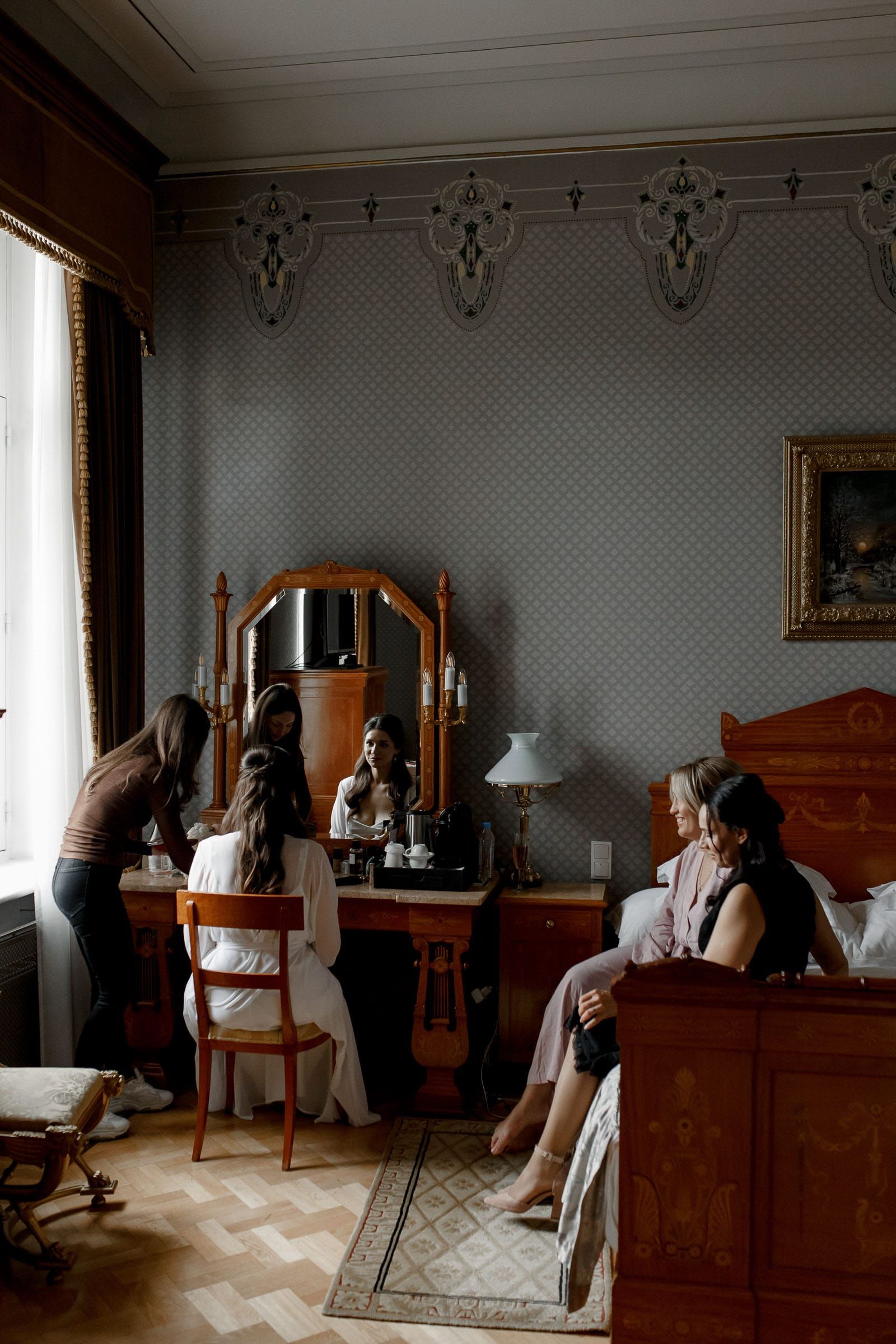 An editorial close-up of bridal makeup application by London documentary wedding photographer Tanya Bogdan.