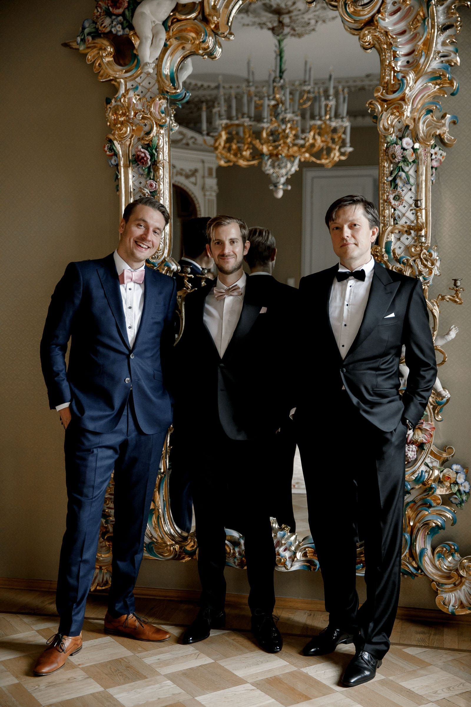A stylish editorial portrait of the groom and his groomsmen by London wedding photographer Tanya Bogdan.