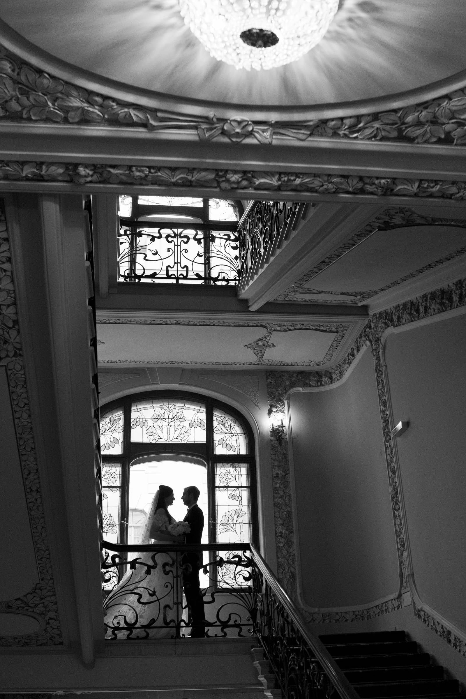 A timeless black and white editorial portrait on a grand staircase by Tanya Bogdan.
