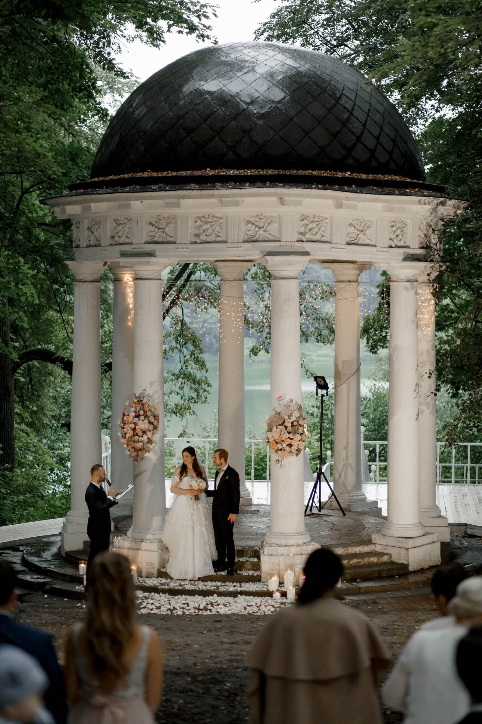 A cinematic editorial shot of an outdoor ceremony by Tanya Bogdan, serving Devon and Cornwall.