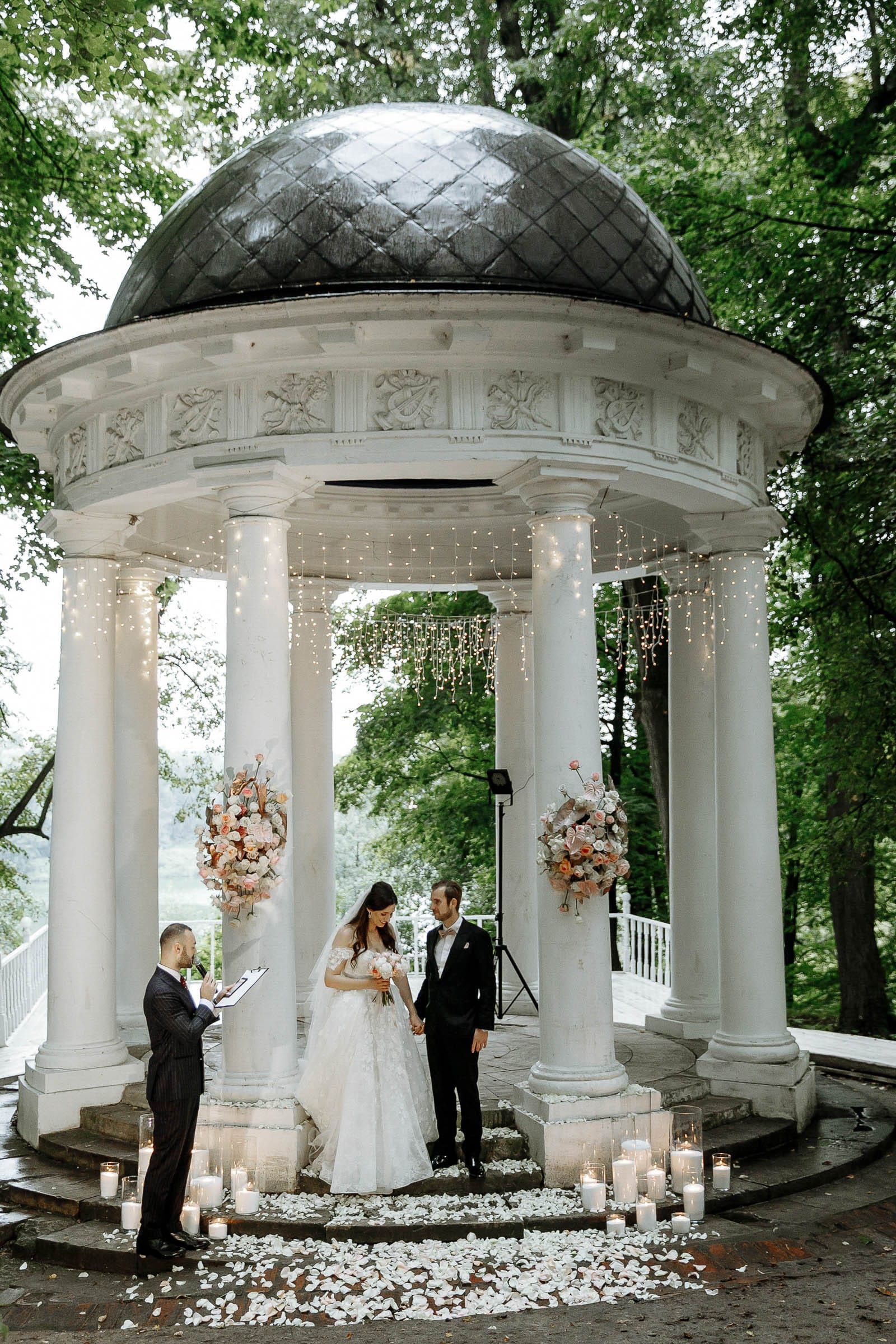 A stylish editorial shot of a couple and celebrant by Tanya Bogdan, serving London and the South West.