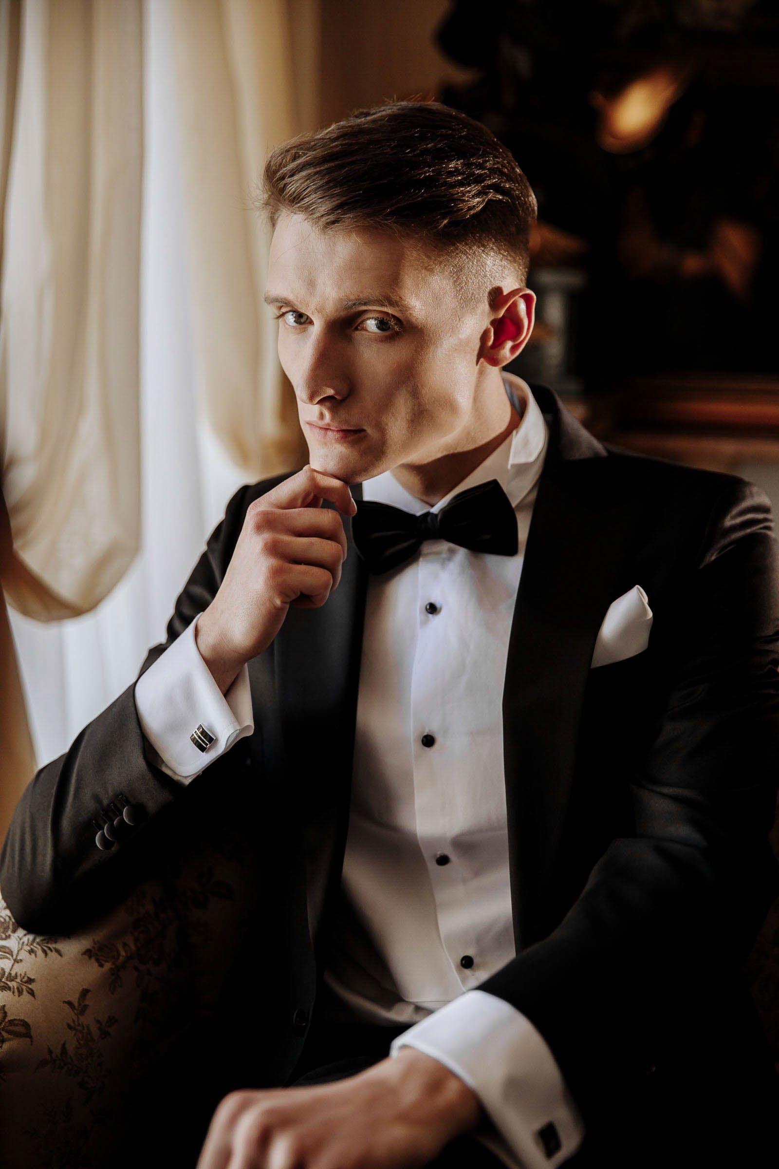 A high-fashion, editorial-style portrait of the groom captured by London wedding photographer Tanya Bogdan.