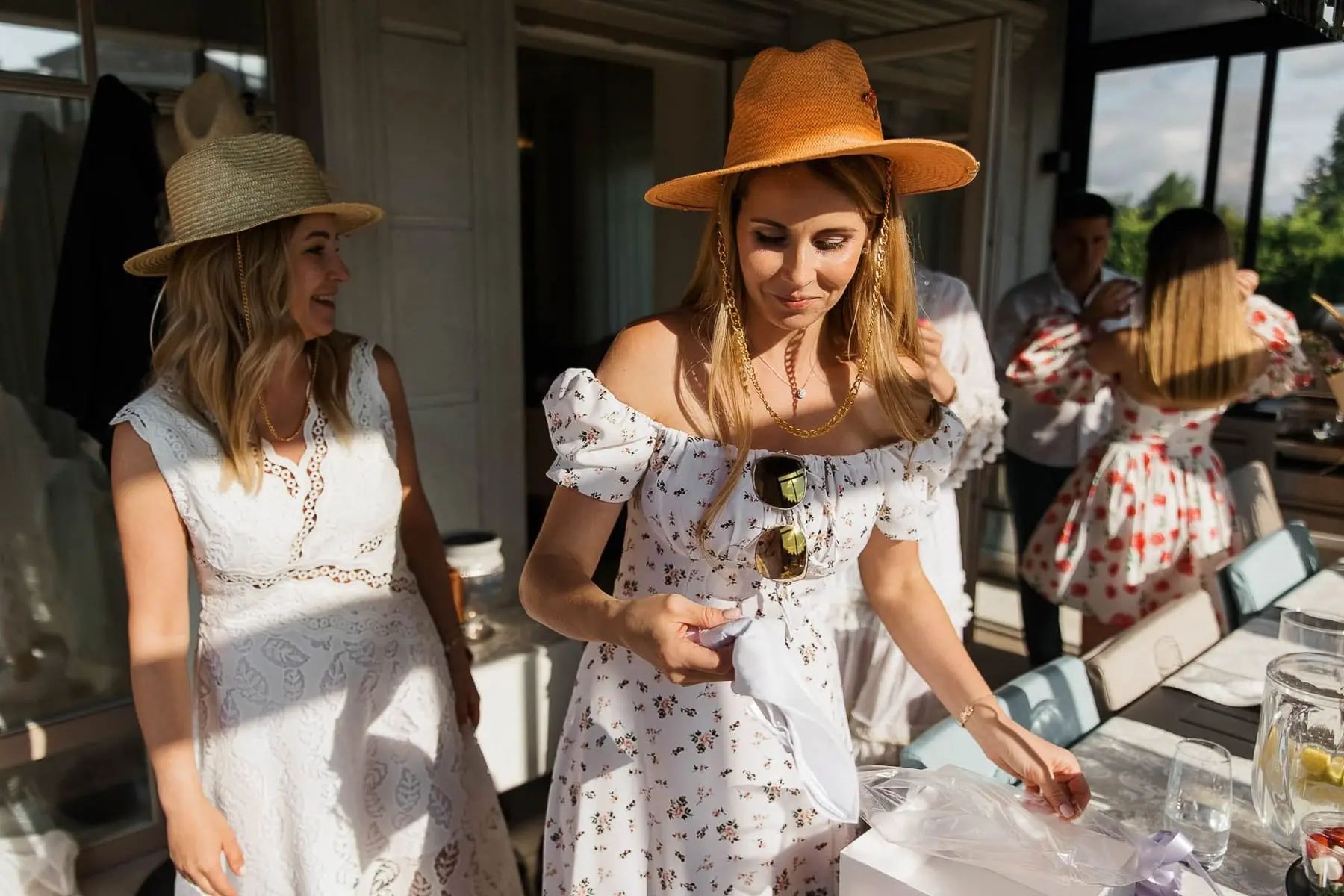 A joyful group photo of friends at a high-end garden celebration, by St Ives photographer Tanya Bogdan.