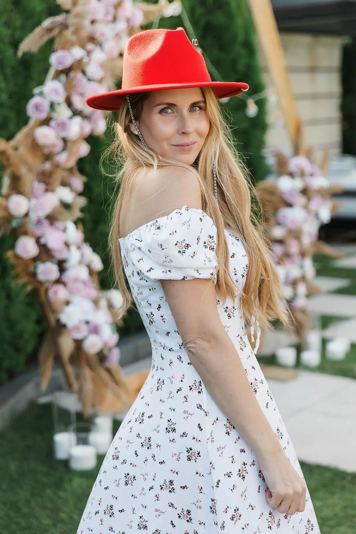 A stunning individual portrait captured in soft natural light at a garden party, by Plymouth photographer Tanya Bogdan.