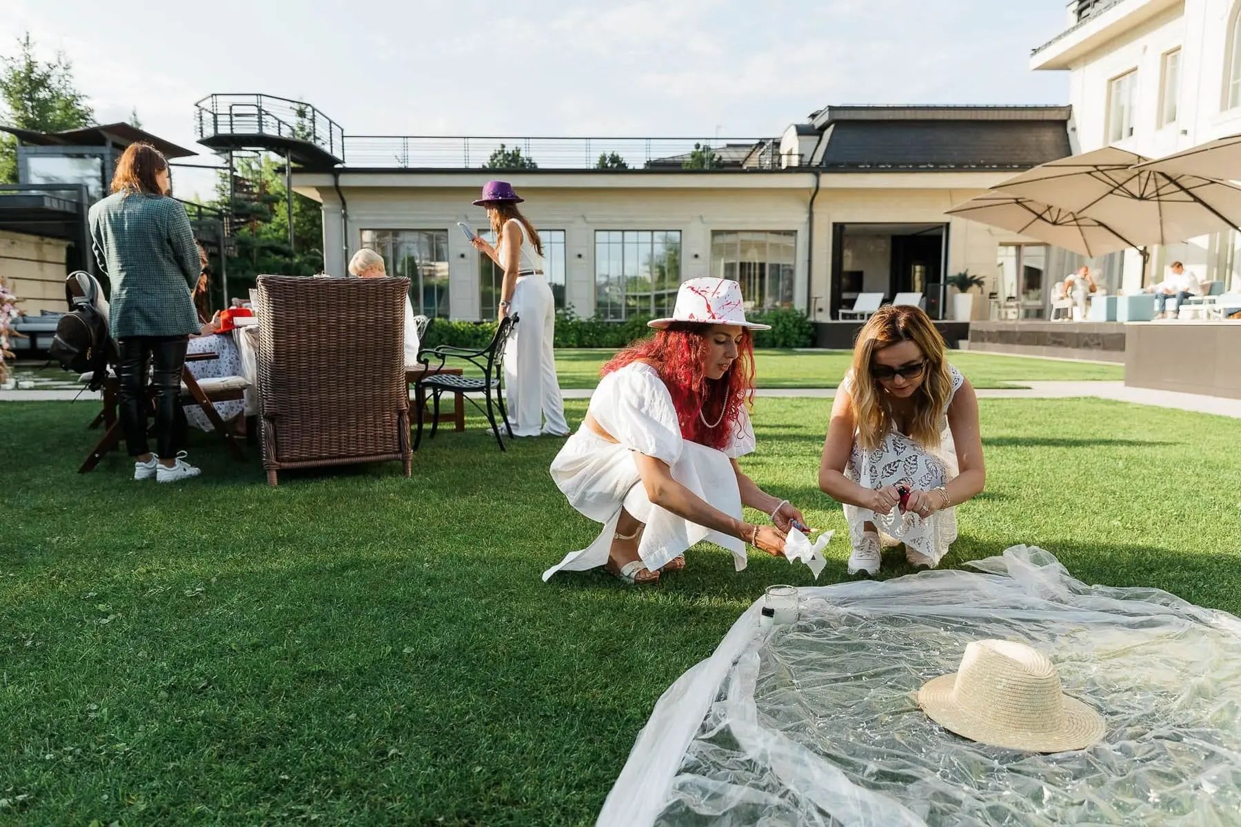 Unique party entertainment featuring a hat-design station at a high-end garden party, by St Ives photographer Tanya Bogdan.