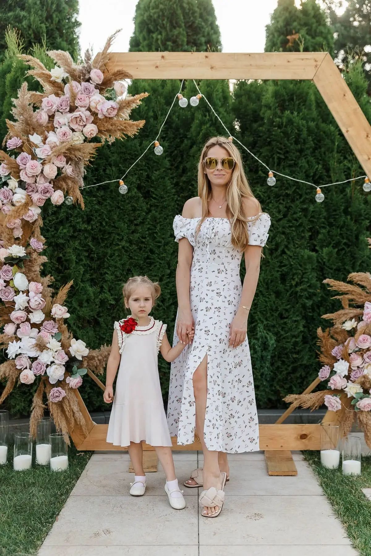 A stylish portrait of a mother and daughter posing together at a luxury birthday event, by Bude photographer Tanya Bogdan.