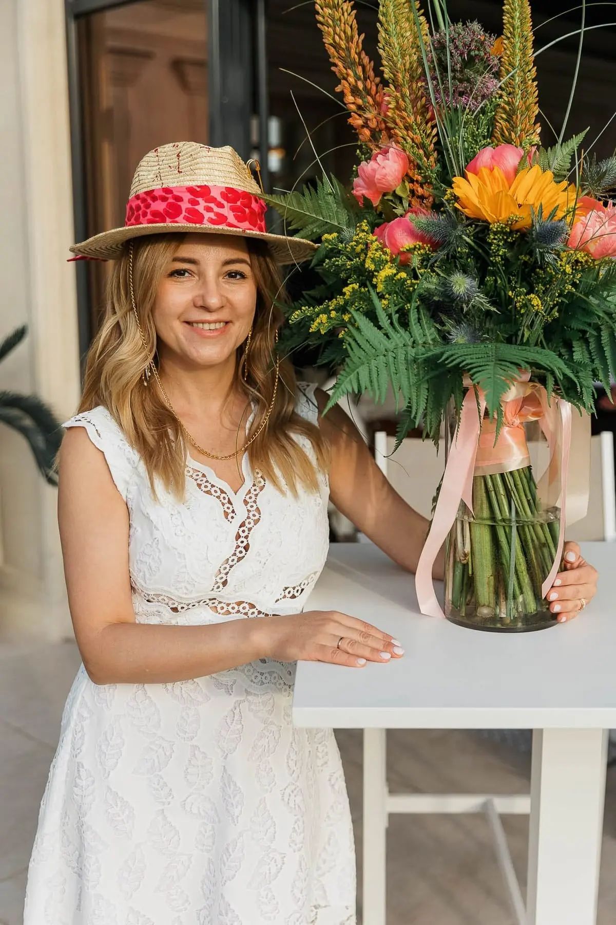 A beautiful lifestyle portrait of a female guest dressed in summer attire, by Bude photographer Tanya Bogdan.