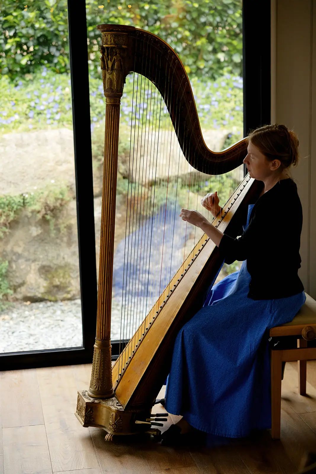 Harpist performing at a wedding at Trevenna