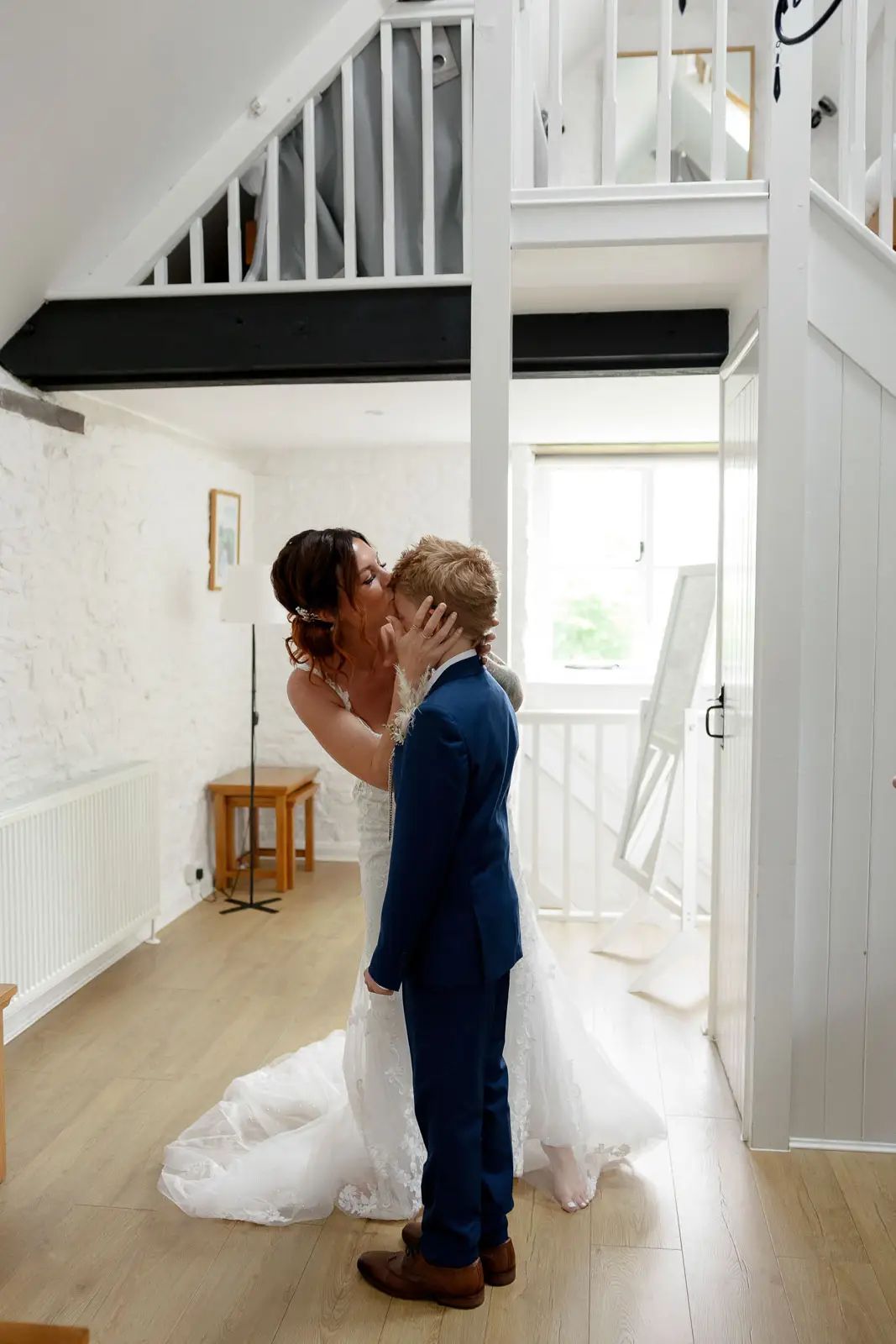 The bride shares a moment with the page boy before the wedding ceremony at Glebe Barn by Tanya Bogdan Photography